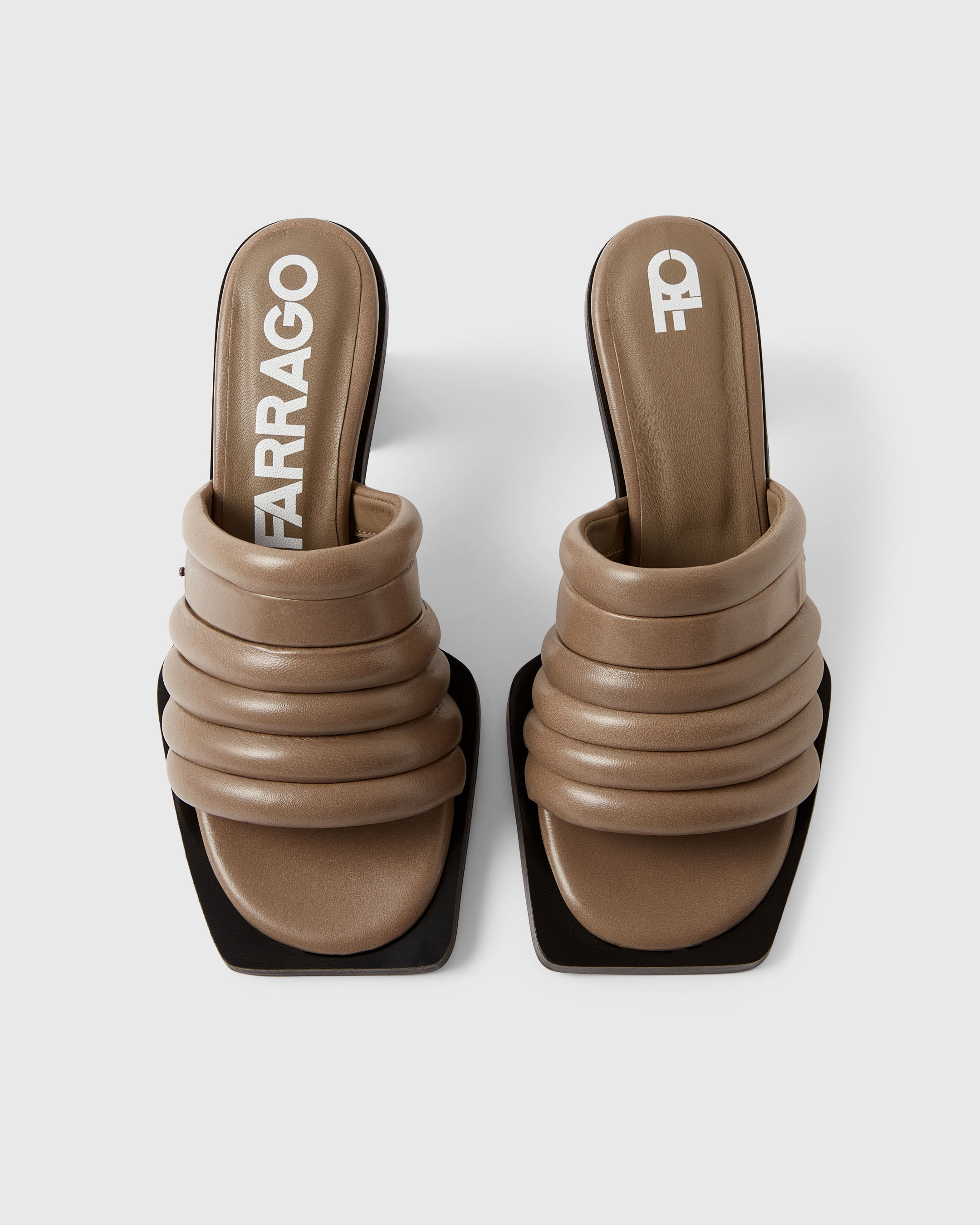 Overhead product shot of a brown pair of Farrago mules