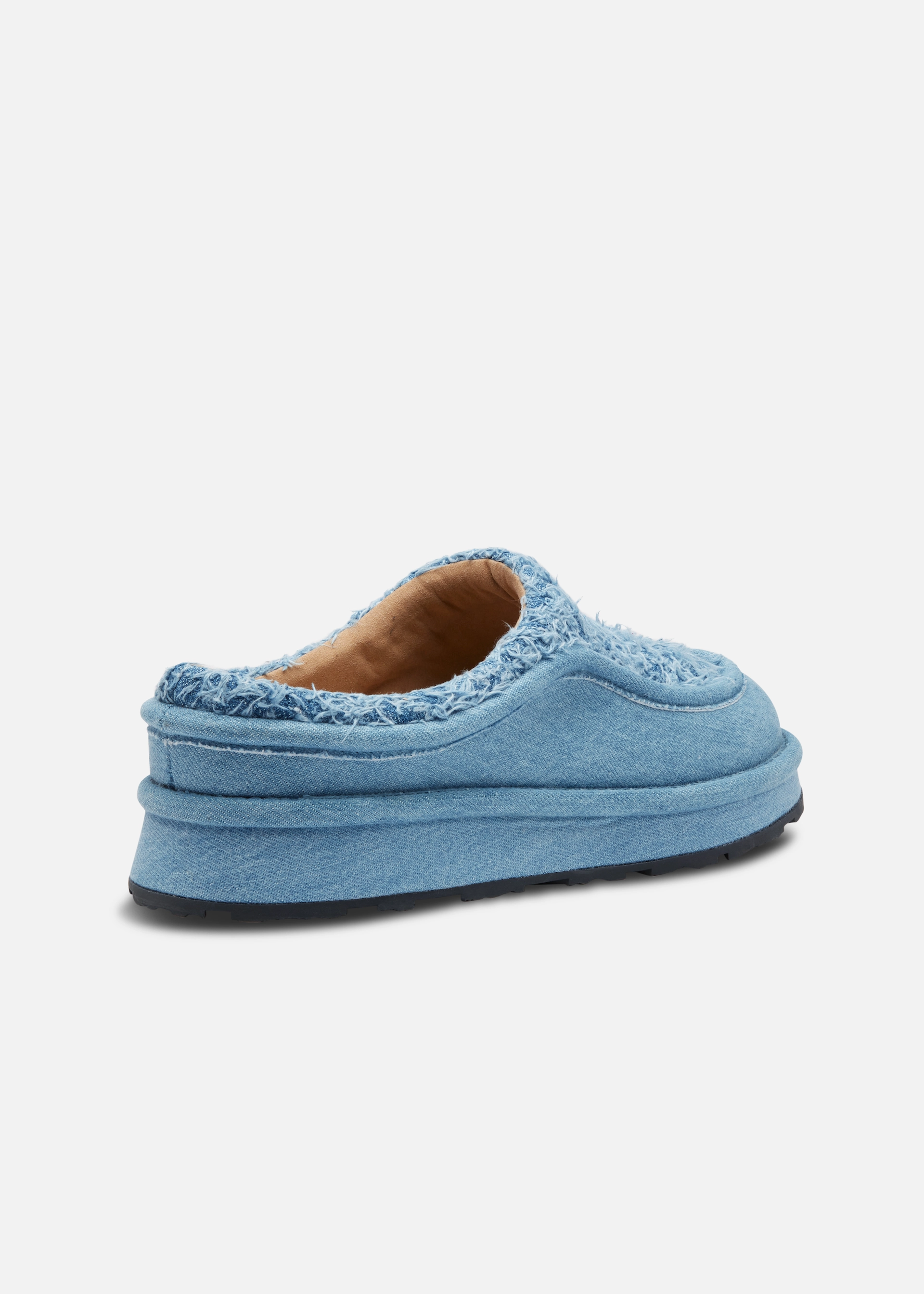 Light blue Axel Arigato slip-on shoe with a textured upper and thick sole on a white background.
