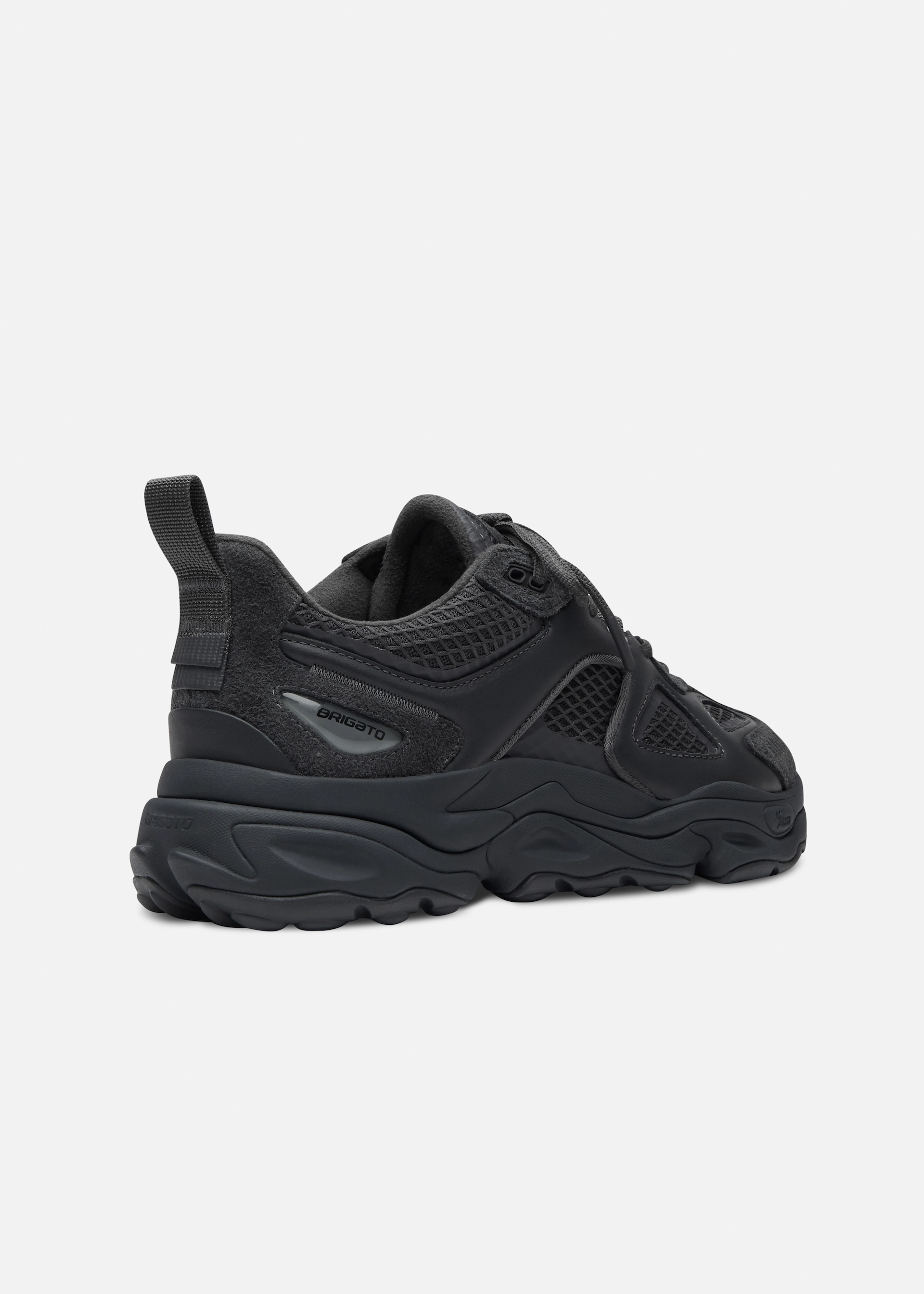 Black athletic Axel Arigato sneaker with mesh and suede details shown from the side and back.