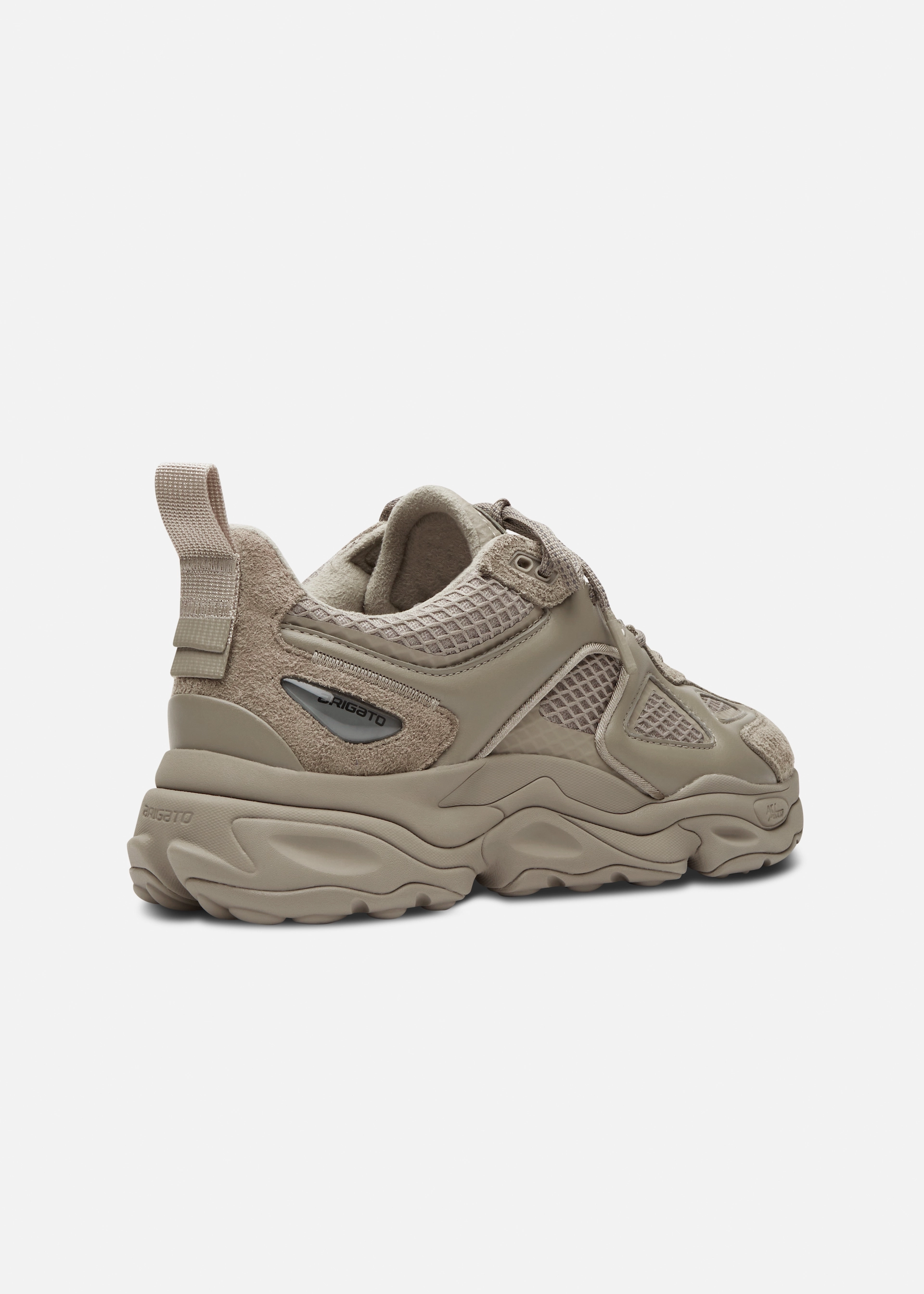 Beige chunky Axel Arigato sneaker with mesh and suede panels and thick sole, angled view from the side-rear.