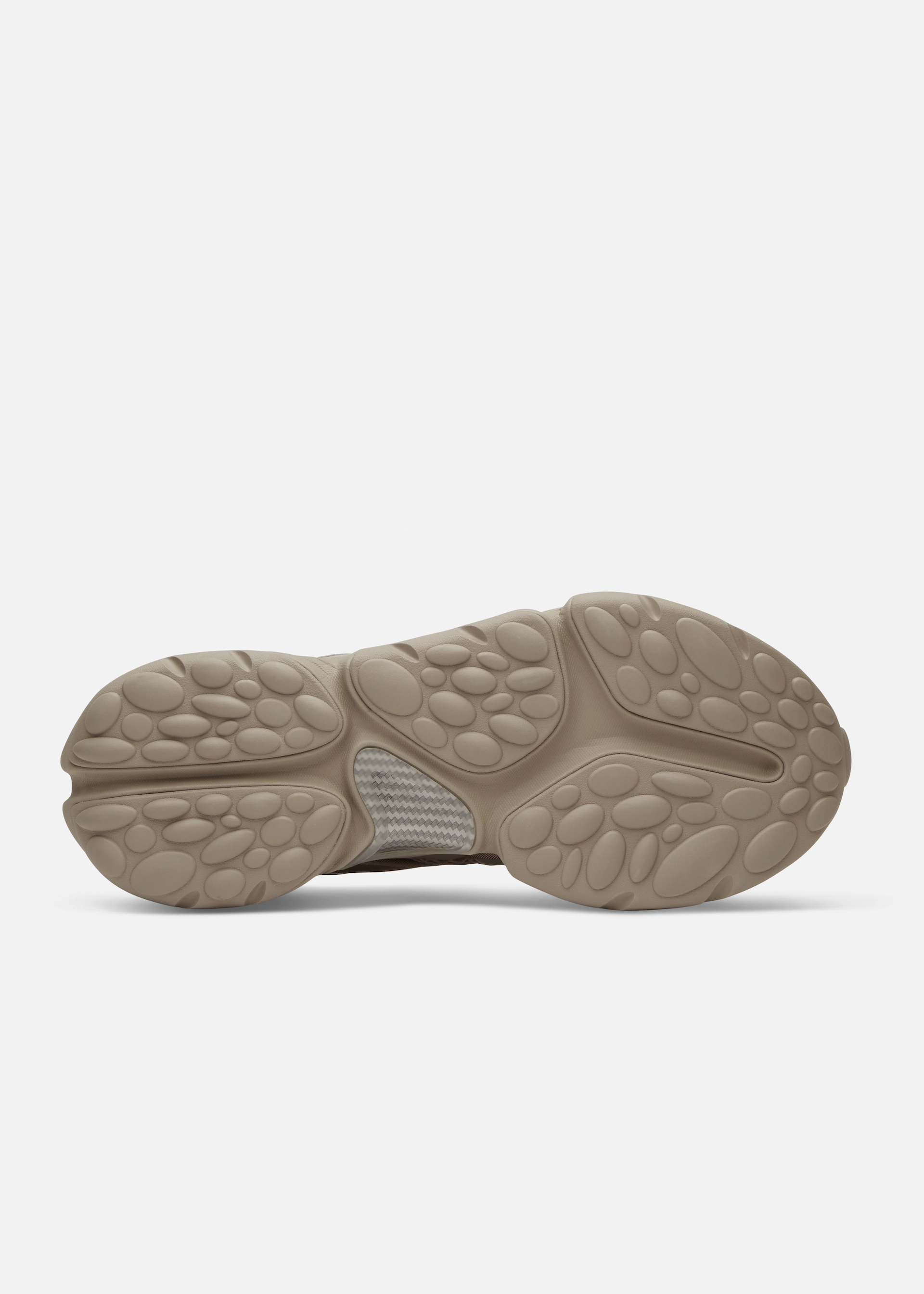 Axel Arigato shoe sole with textured oval patterns and a herringbone design near the arch.