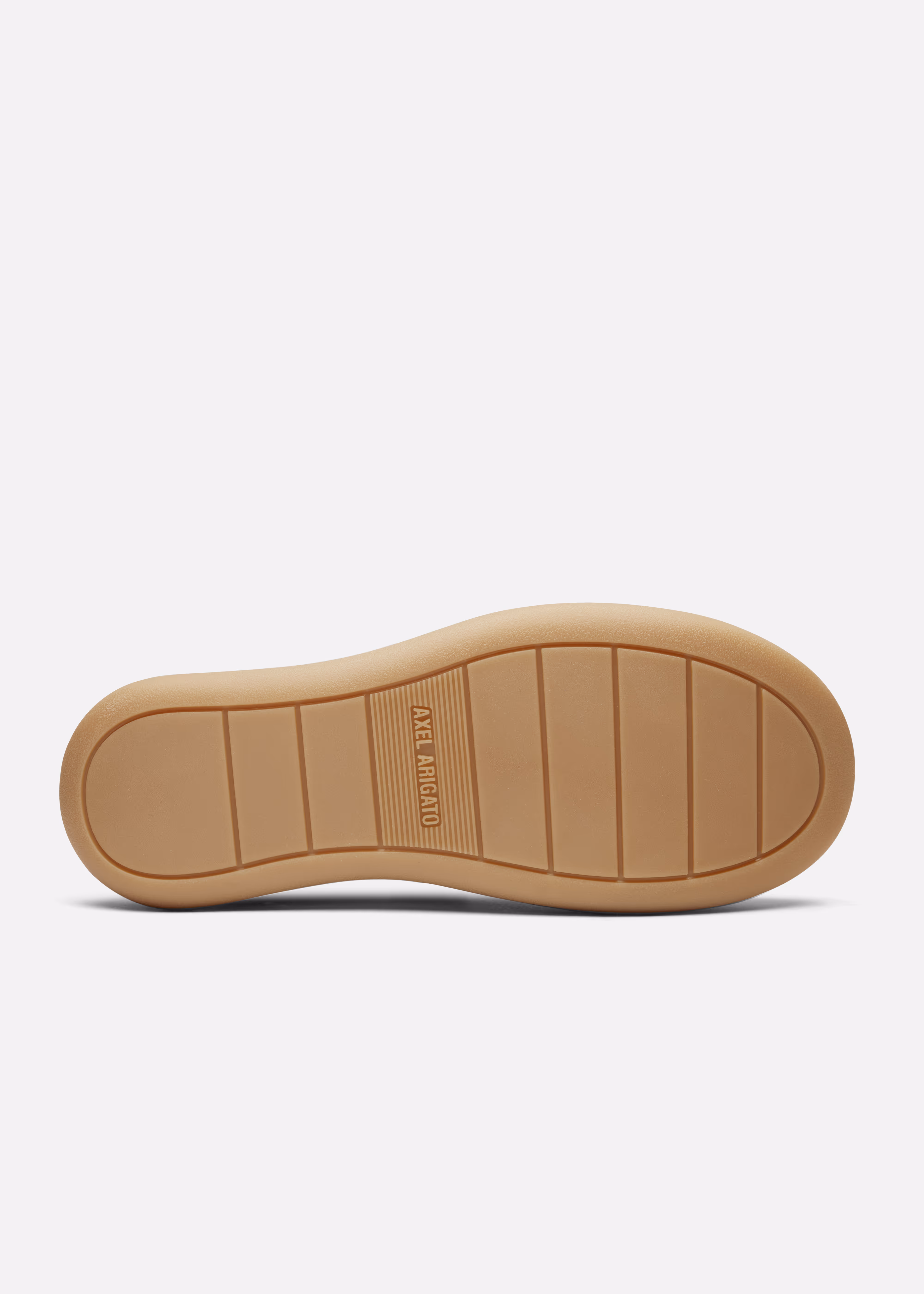 Axel Arigato Light brown rubber shoe sole with grooves and AXEL ARIGATO branding at center.
