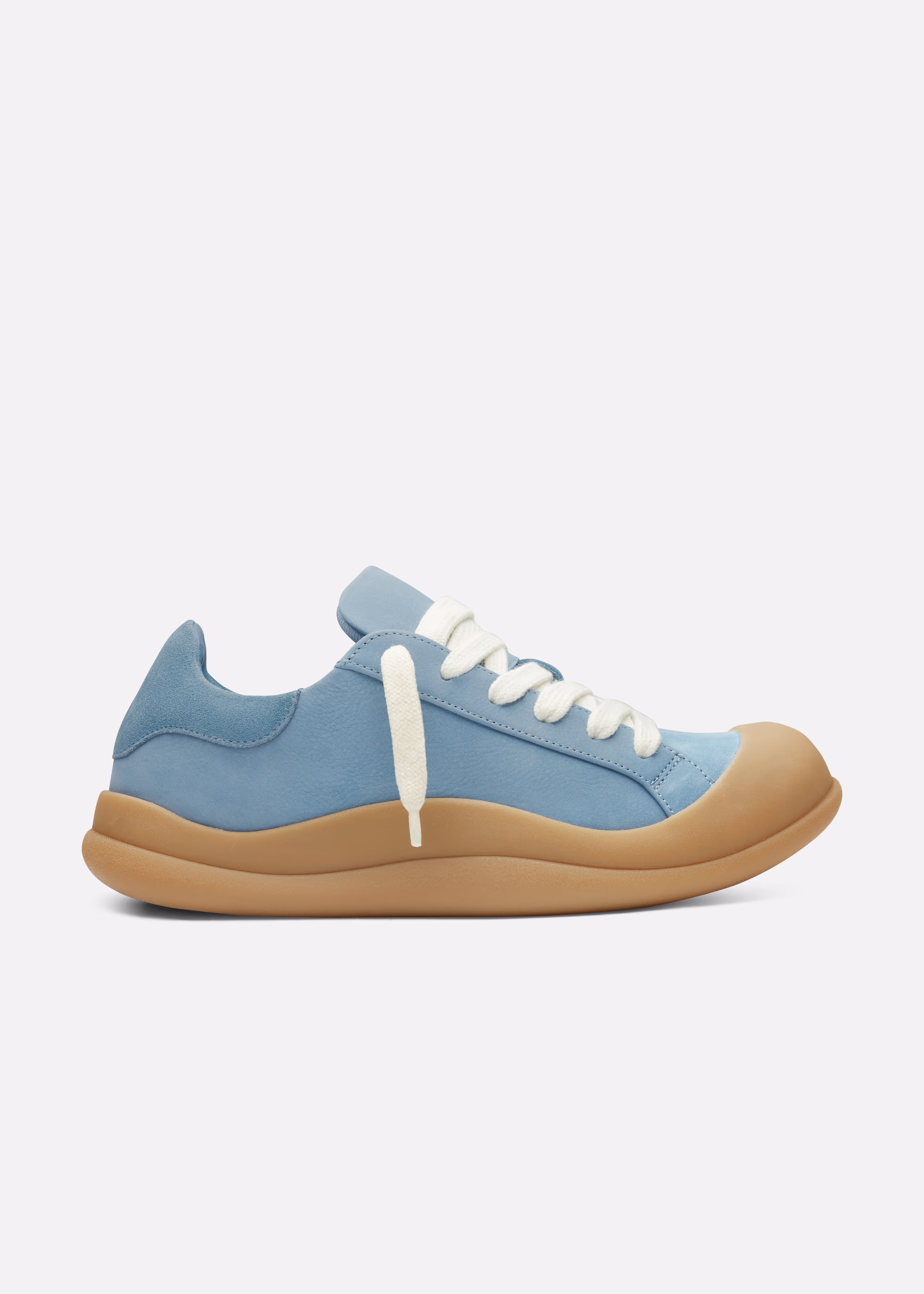 Light blue Axel Arigato sneaker with thick brown sole and white laces on a white background.