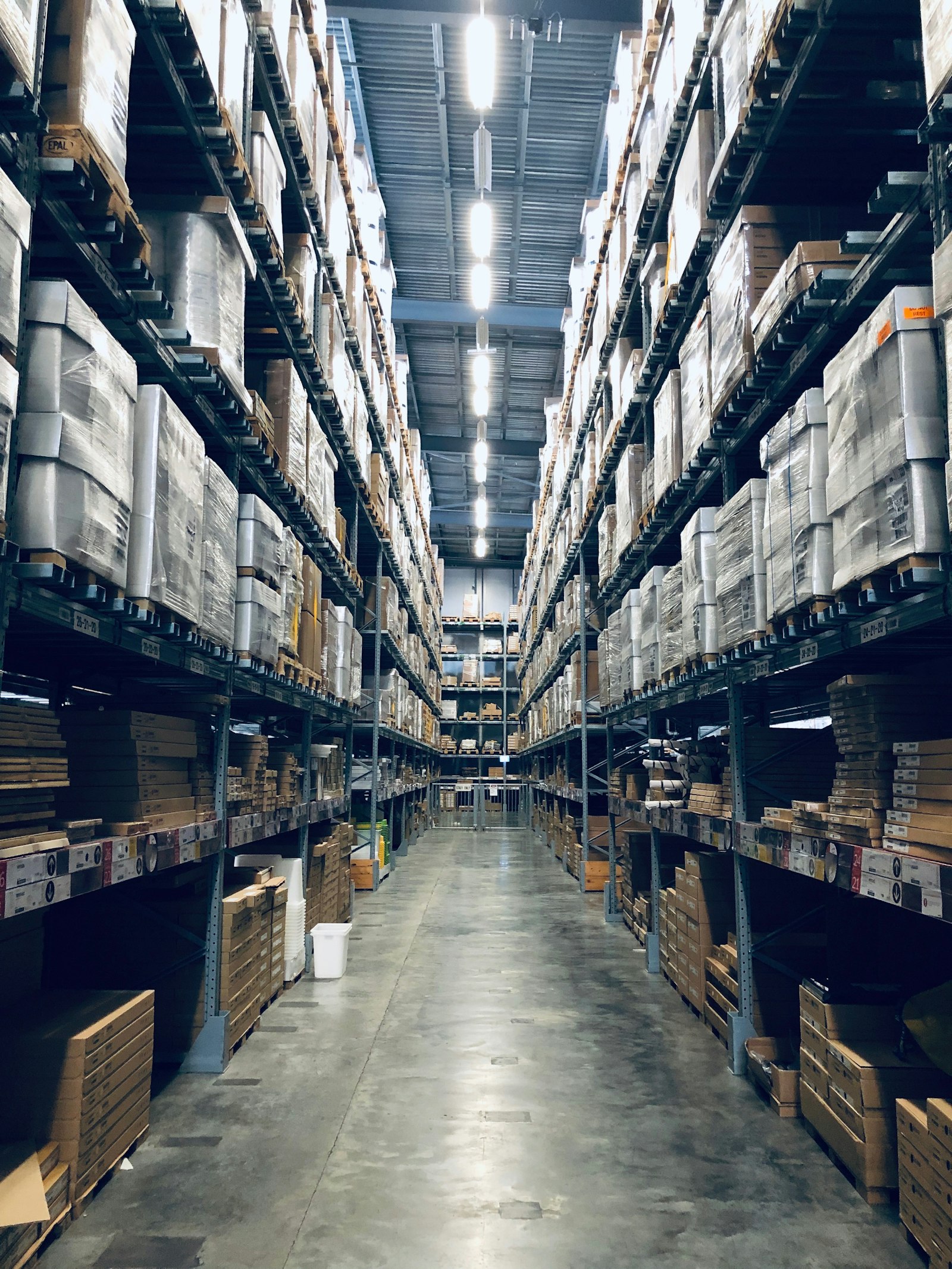 Tall racking aisles inside a pharmaceutical distribution warehouse