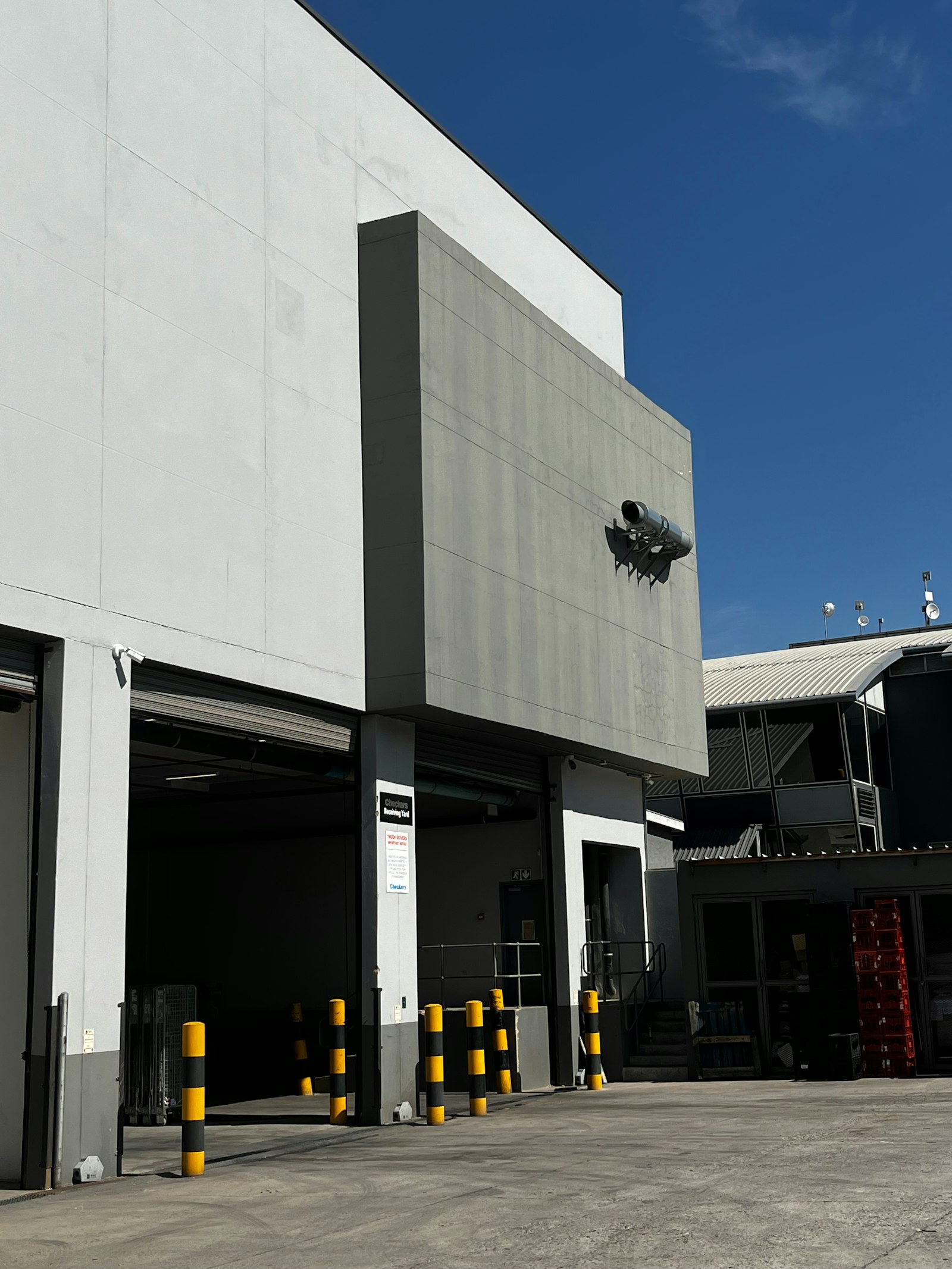 Modern industrial building exterior with loading docks