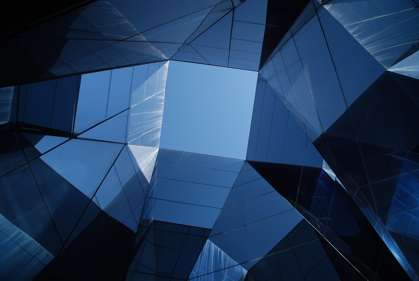 Faceted navy glass architecture