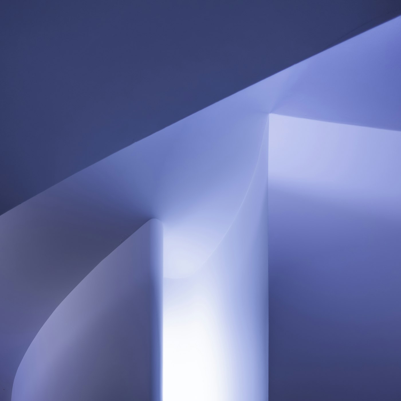 Geometric navy and white facade of a modern institutional building