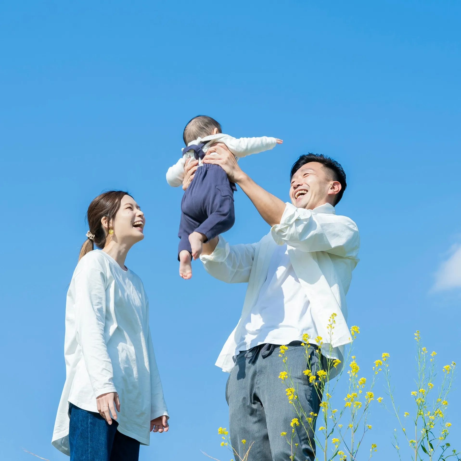 A young family with a baby, representing clients planning for their family's financial future with Sears Group.