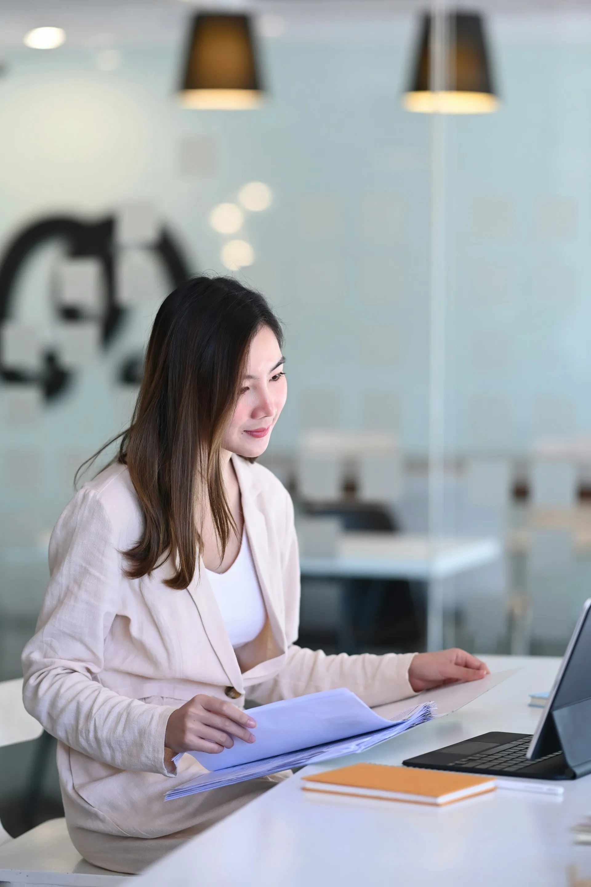 A young professional working at a desk, representing early-career clients who partner with Sears Group to build their financial foundation.