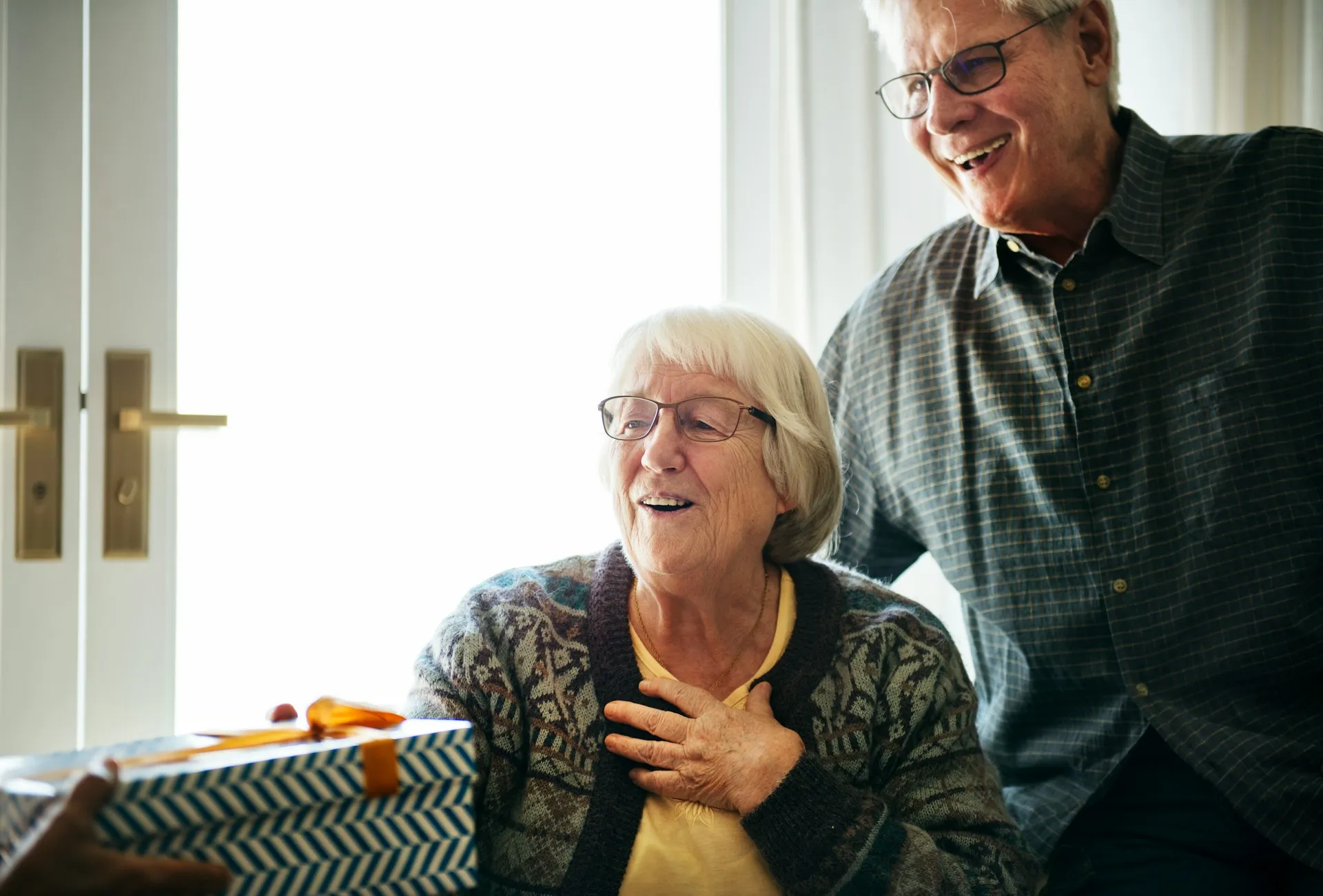 A couple reviewing documents as they prepare for retirement, representing the planning process at Sears Group.