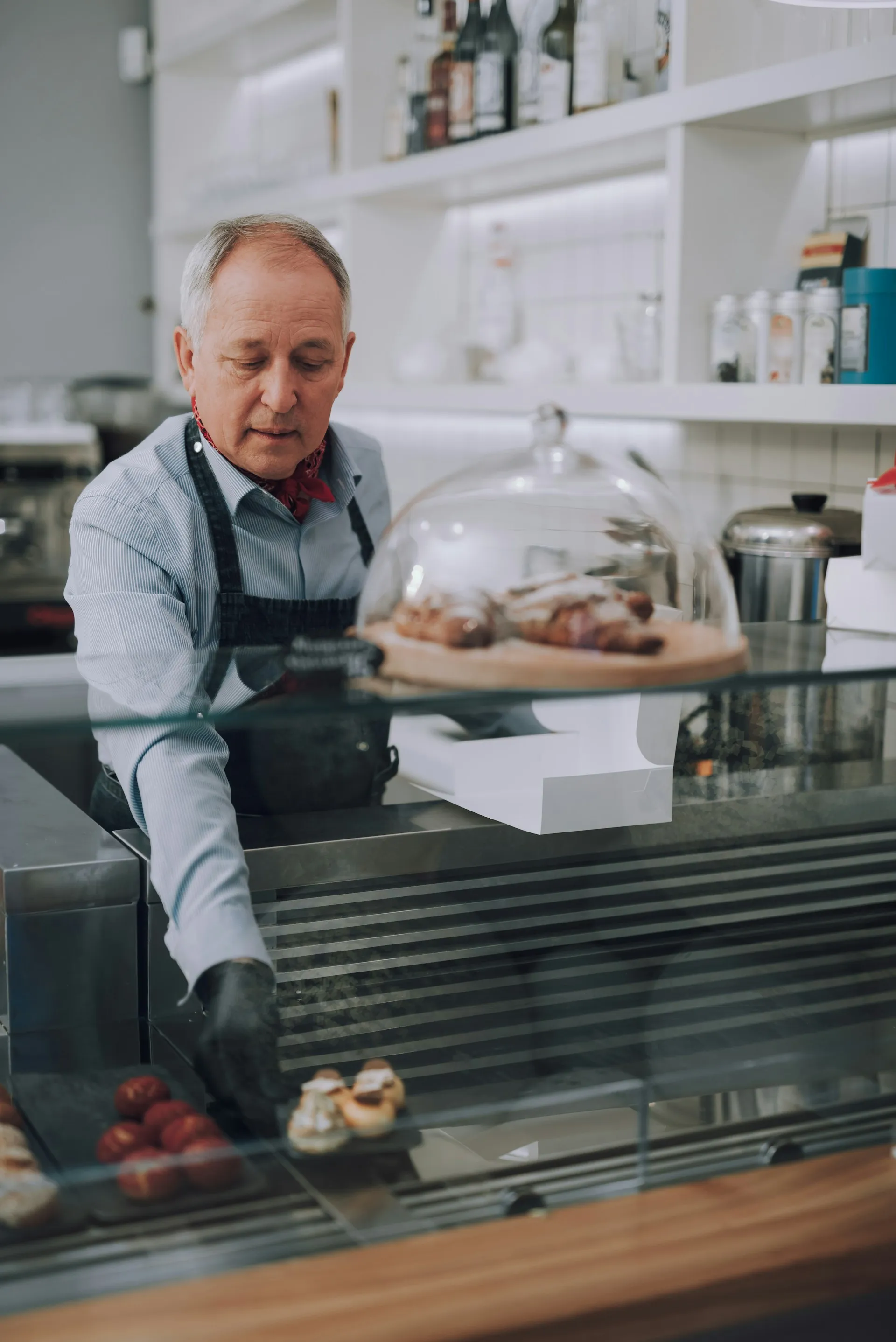 A small business baker at work, representing the entrepreneur and business-owner clients Sears Group helps with financial planning.