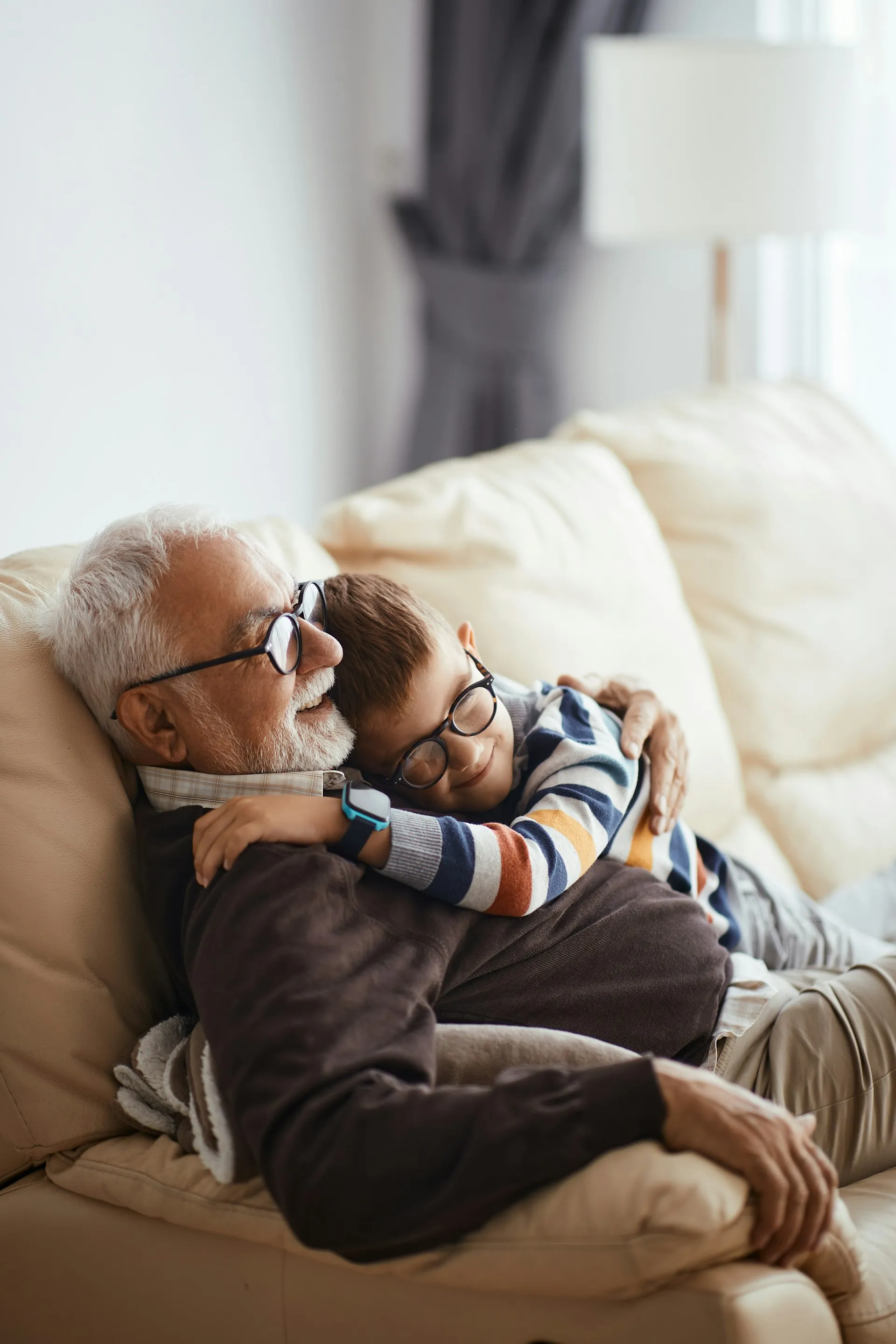 A grandfather and grandchild together outdoors, representing the legacy and family values that guide estate planning at Sears Group.