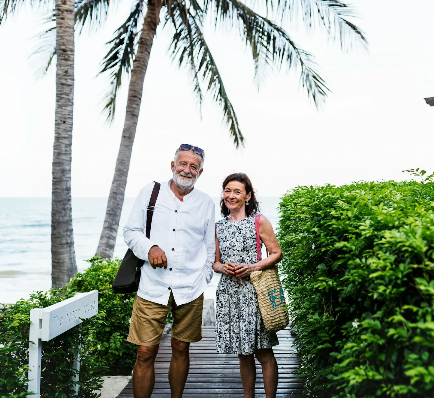 A retired couple laughing together while traveling, enjoying life in retirement.