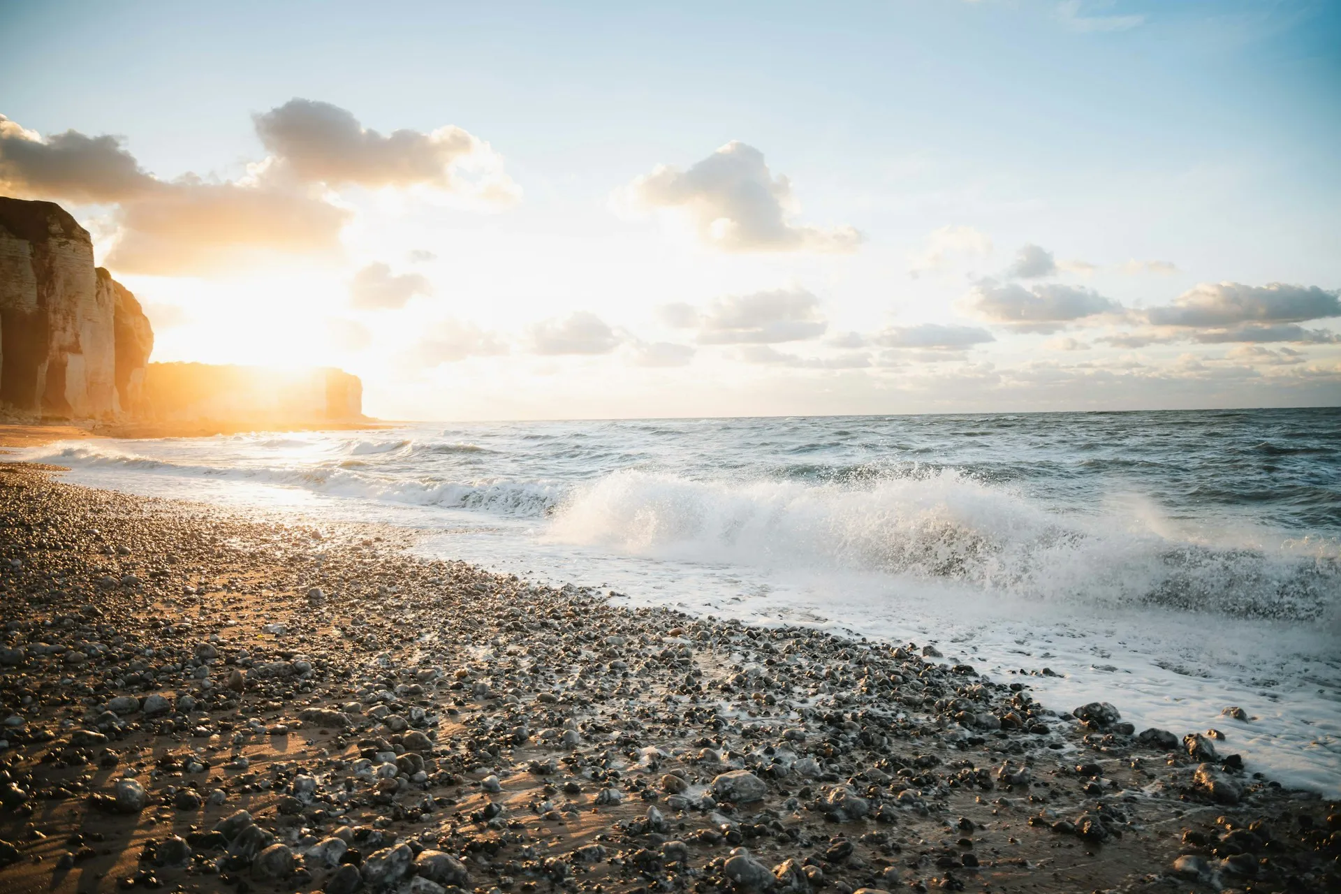 A tranquil beach shoreline with gentle waves, evoking the peace of mind that comes with a sound financial plan.