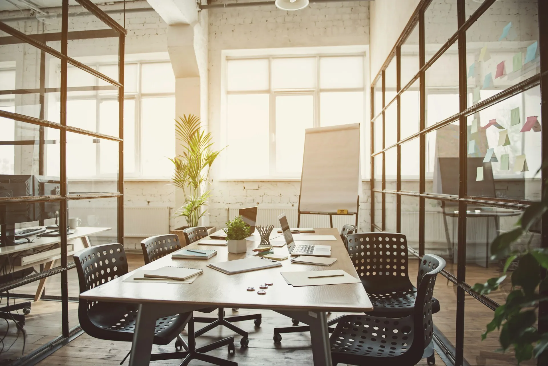 A professional meeting room with a conference table, representing collaborative financial planning sessions at Sears Group.