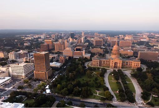Aerial view of Austin, Texas downtown with the Texas State Capitol building and surrounding office buildings.