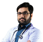 Confident male doctor with glasses and stethoscope, arms crossed, in white coat on white background.