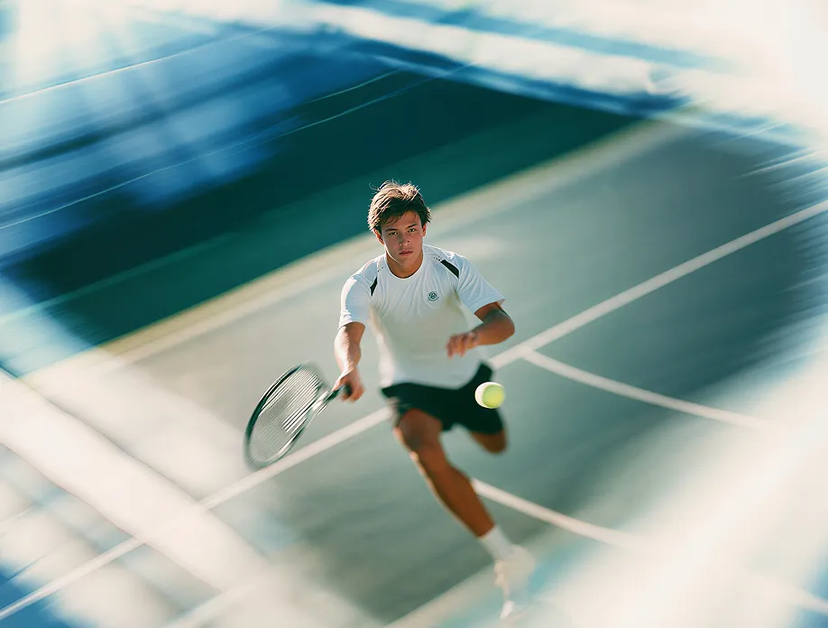 Aerial view of a person playing tennis on a court