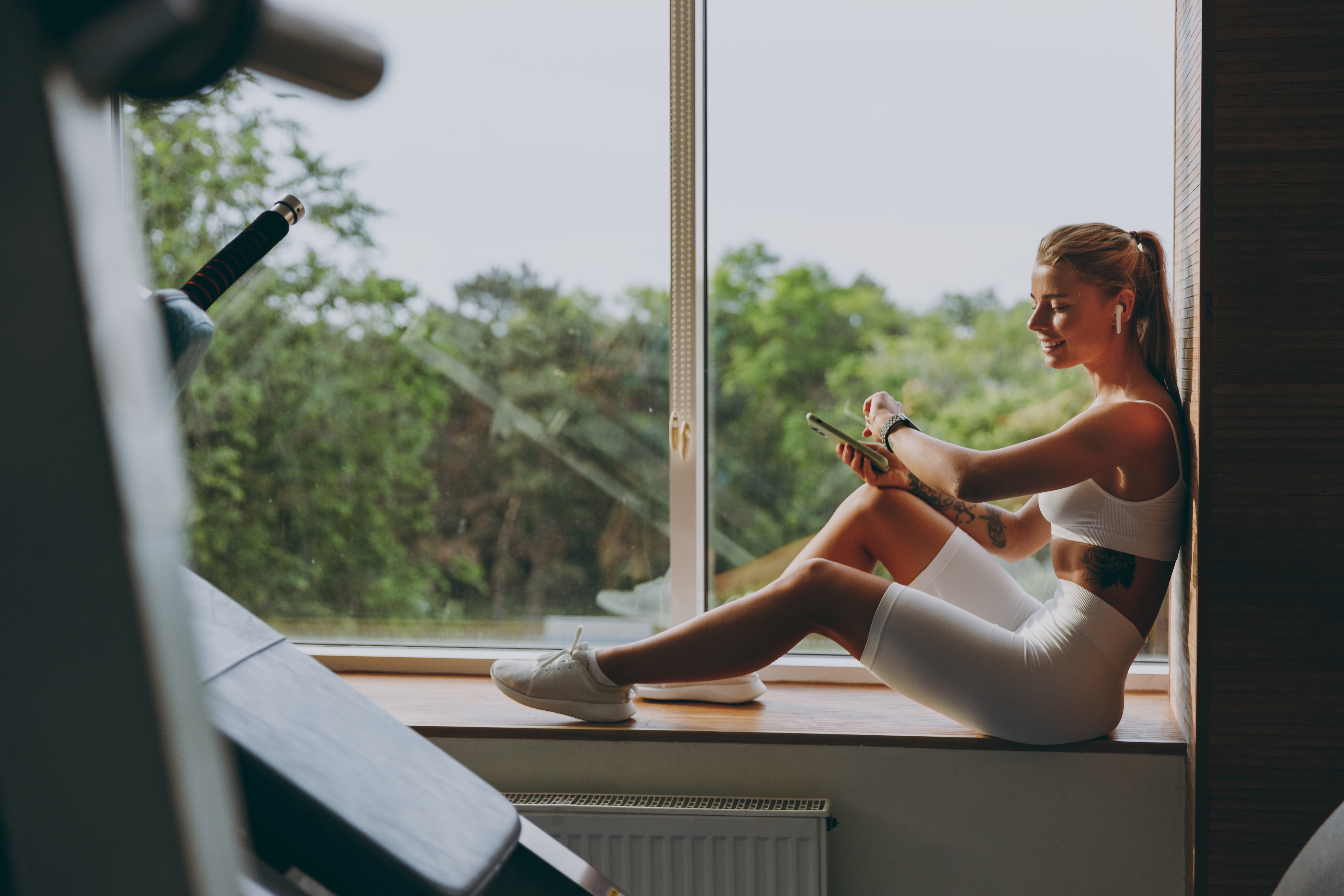 Woman sitting in the window sill stock image