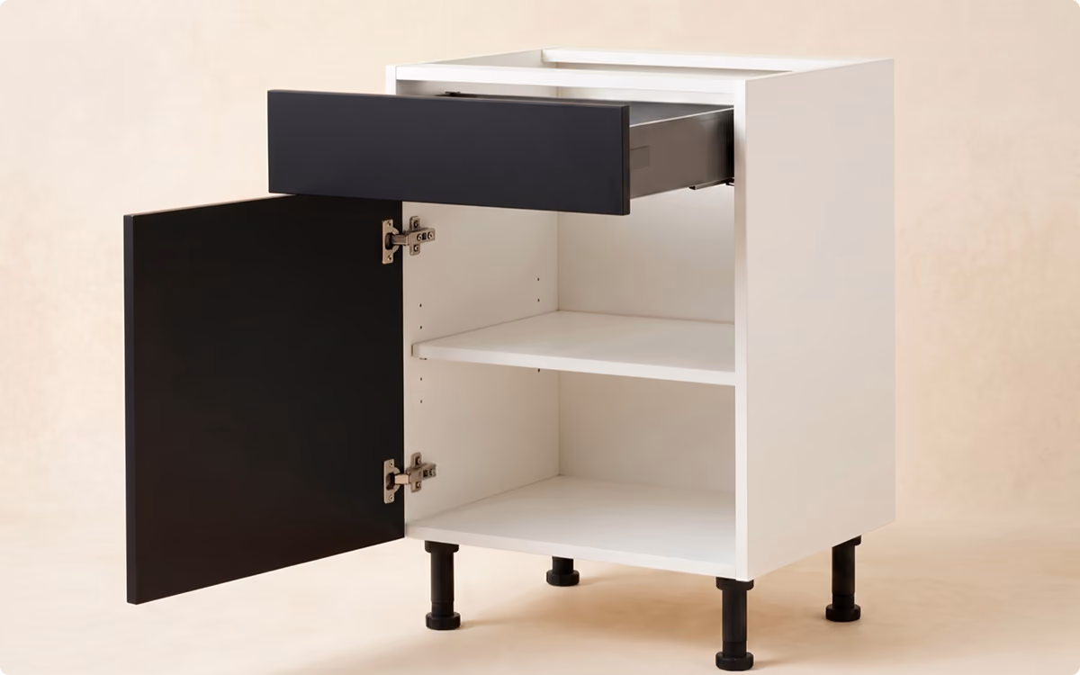 White cabinet with black door open and black drawer partially pulled out on black legs.