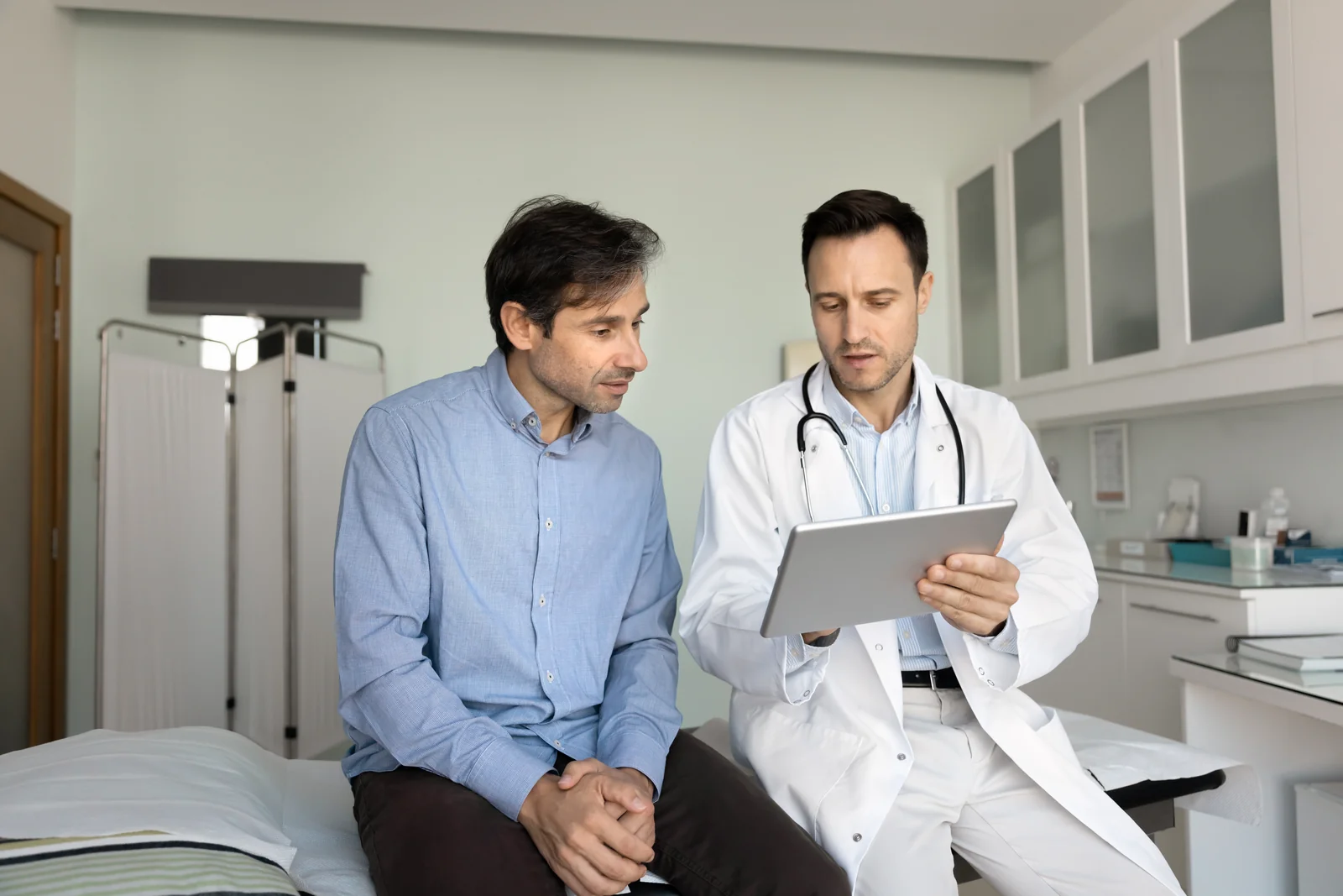 Primary care provider discussing retinal screening results with a patient