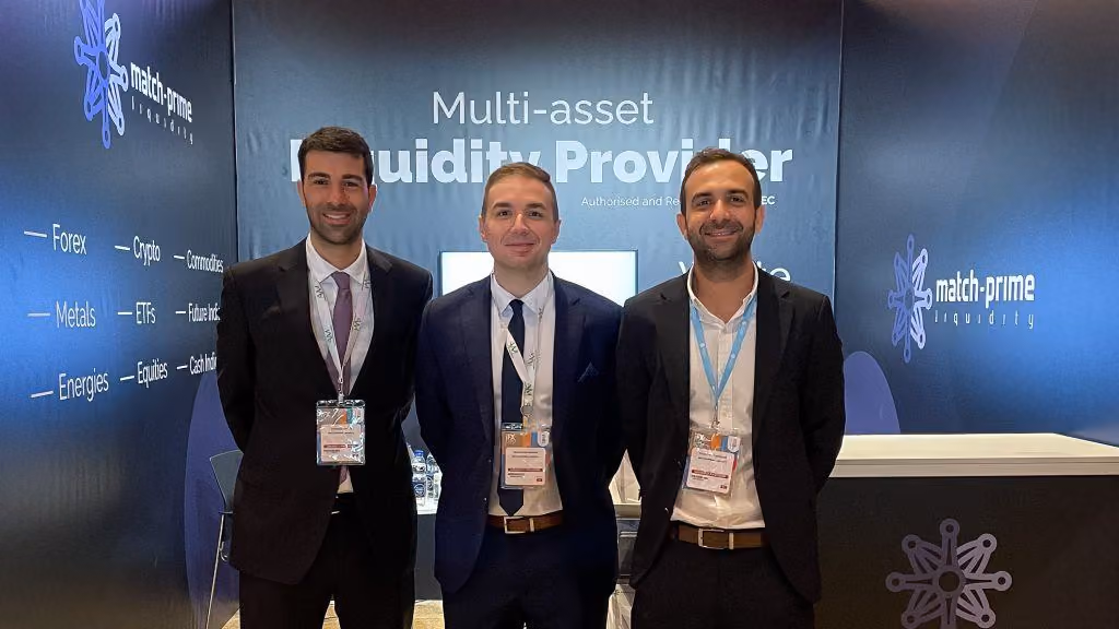 Three Match-Prime team members at the company’s multi-asset liquidity provider stand at the expo