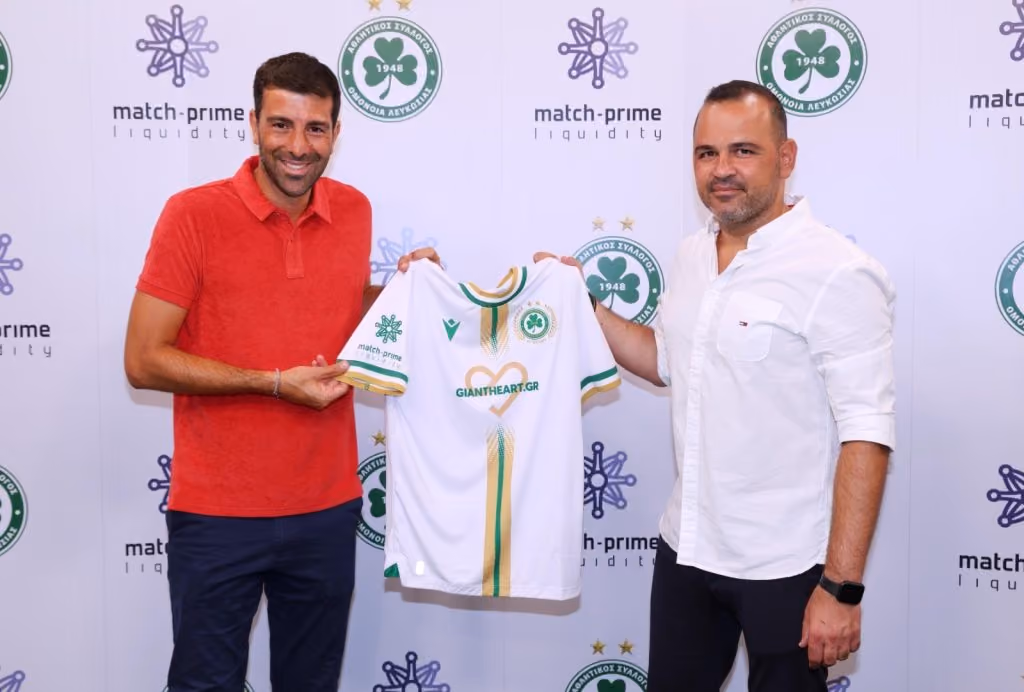 Match-Prime and Omonoia Nicosia representatives holding the club’s shirt