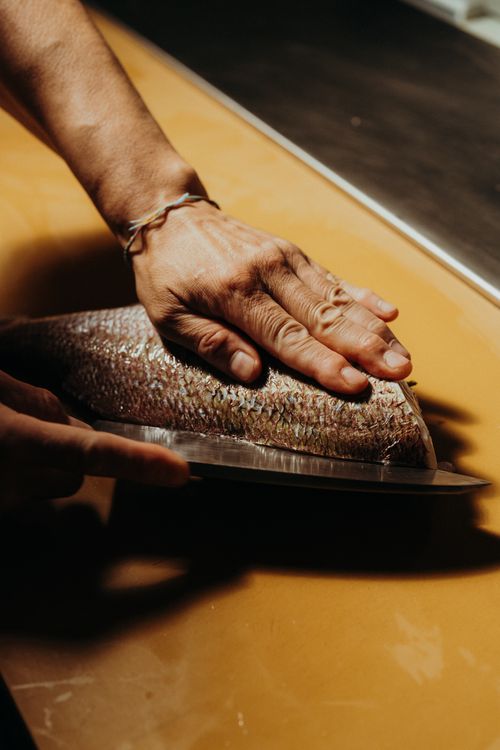 Chef plating a dish at YAMA Restaurant in downtown Montréal