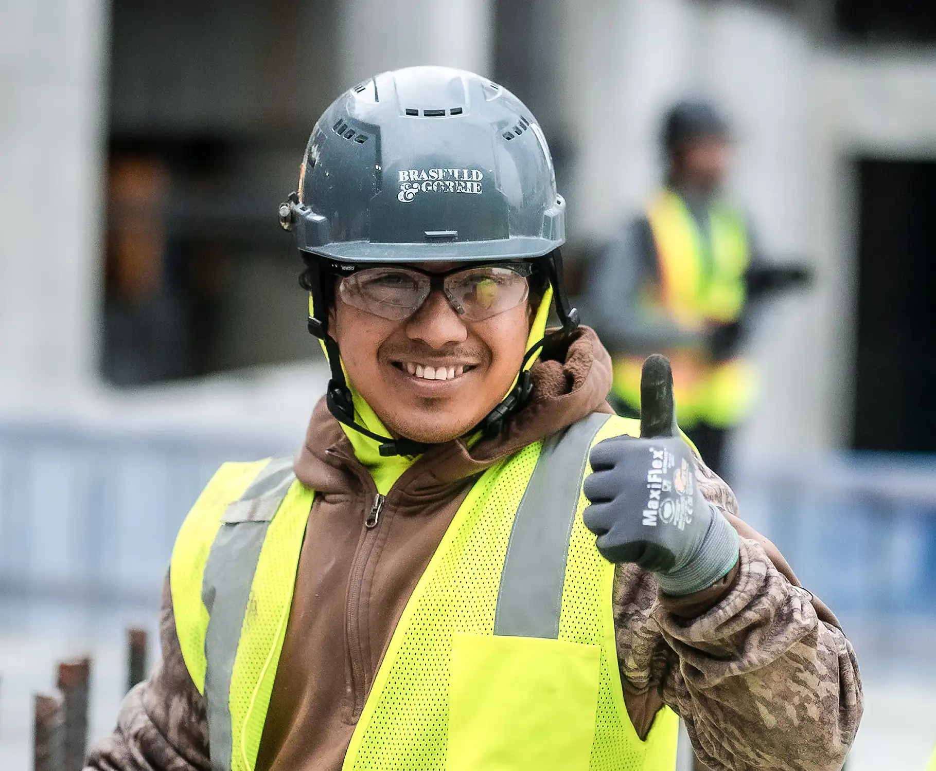 A Brasfield and Gorrie construction worker with a thumbs up.