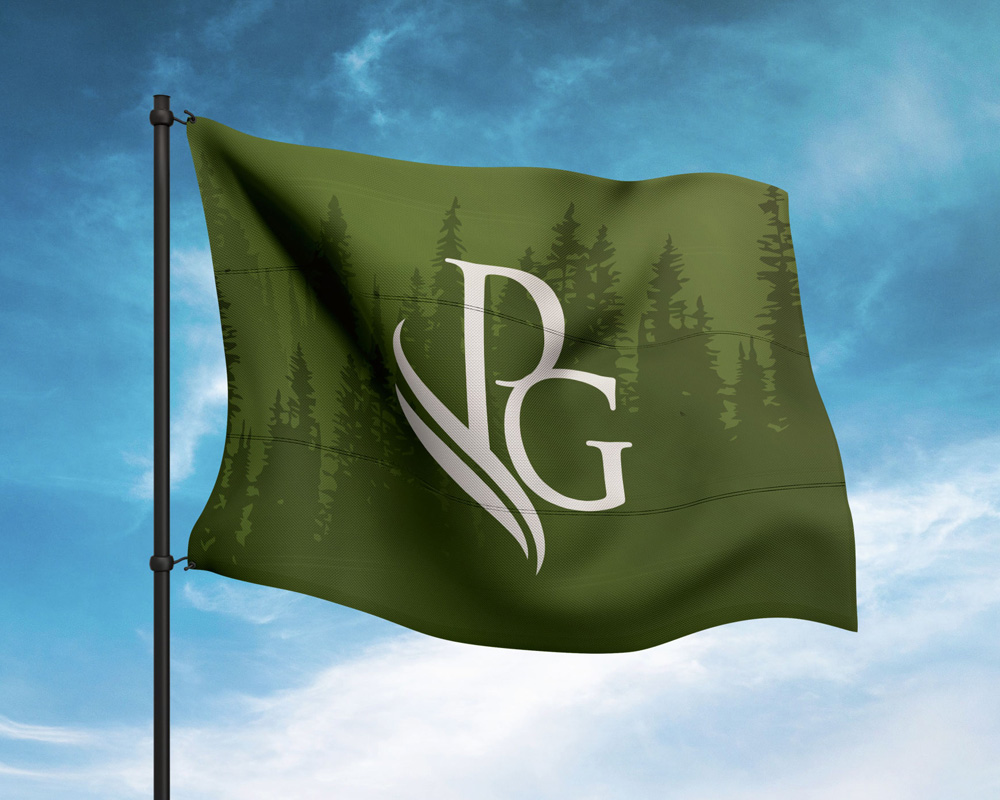Green flag with a stylized white 'PG' logo featuring abstract leaf shapes, waving against a partly cloudy blue sky.