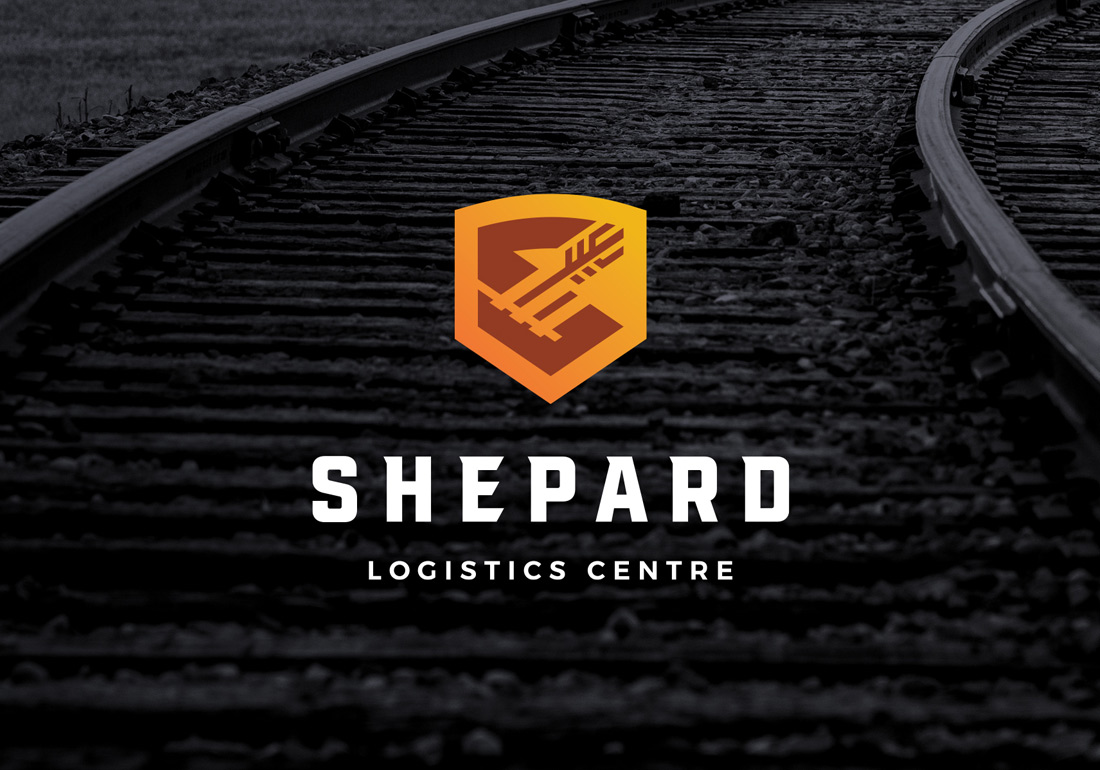 Logo for Shepard Logistics Centre featuring a stylized orange and yellow shield with an arrow design above the company name in bold white uppercase letters on a dark background.