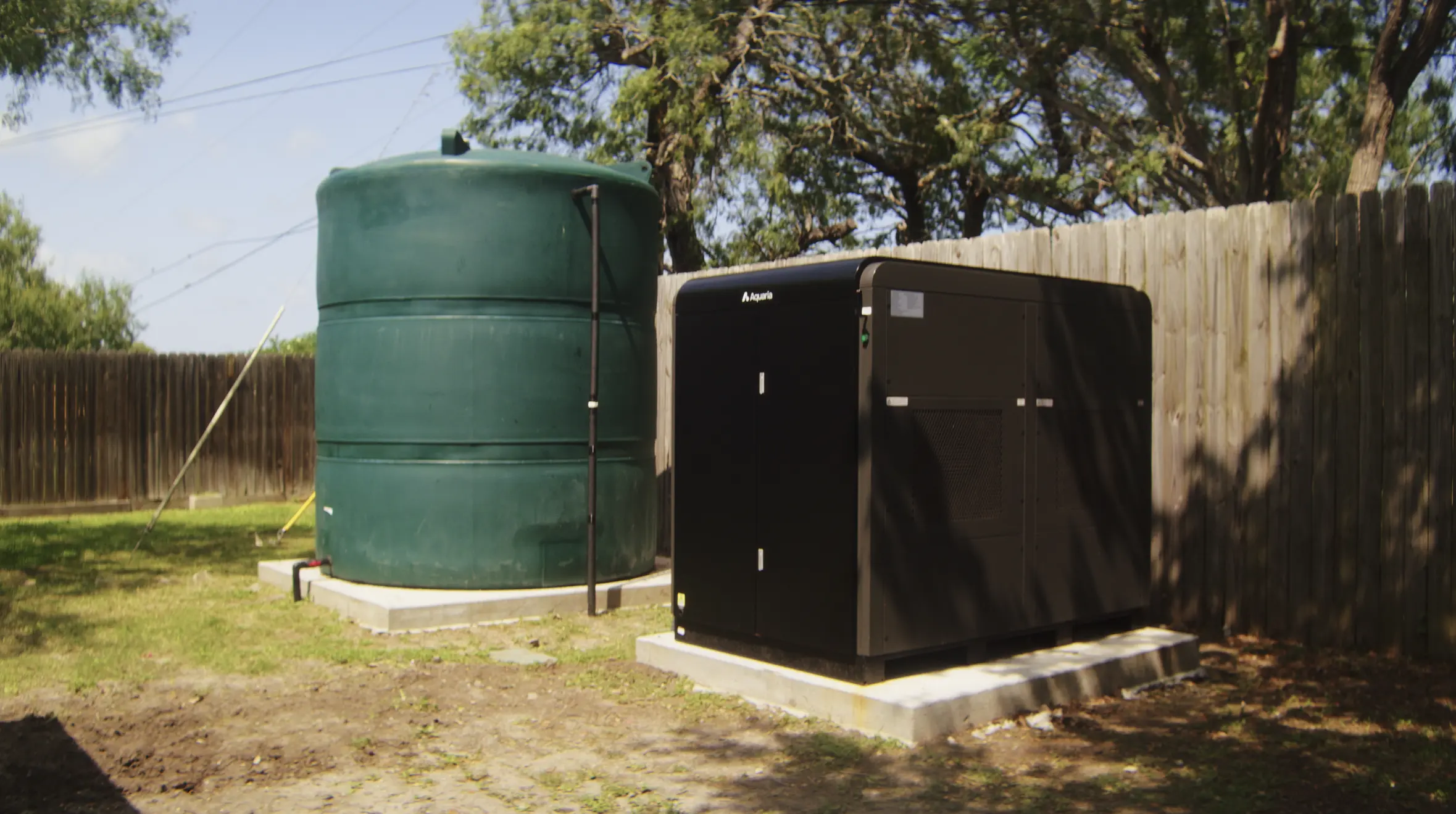 An Aquaria Hydropack installed beside a rural water tank in Texas Hill Country