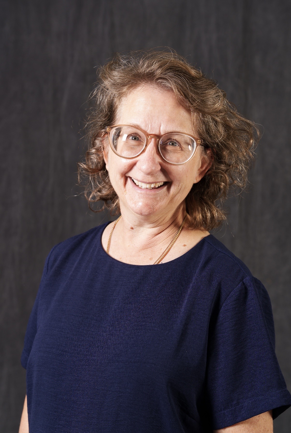 Lisa Stobb staff directory photo smiling with glasses