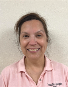 Edith Alvarado smiling staff member at Immaculate Conception School