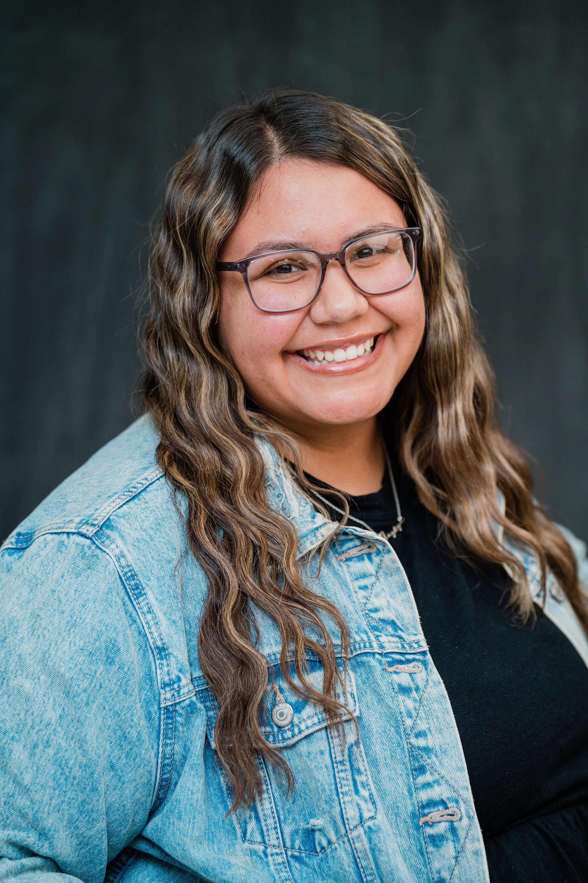 Jozlyn Munoz smiling in a professional staff portrait