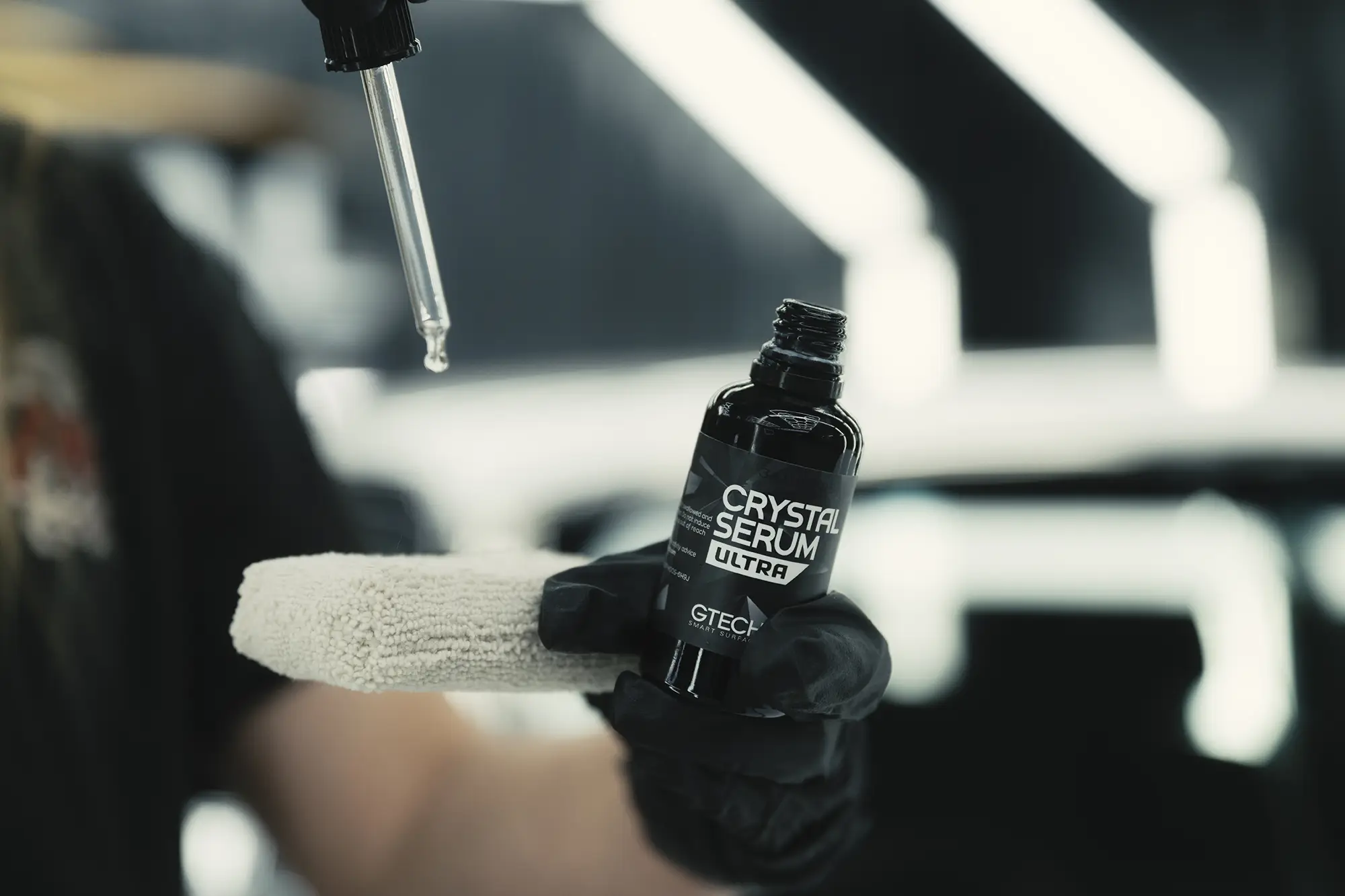 Crystal Serum being eye-dropped onto a microfibre pad
