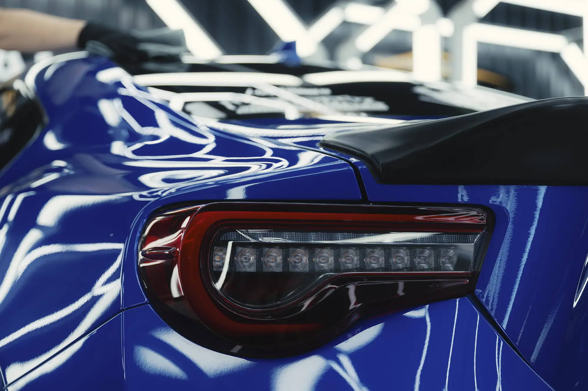 Clean Rear Headlight on a blue Subaru Impreza.