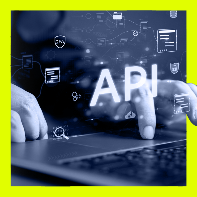 Hands typing on laptop keyboard with overlay of glowing API text and security icons.