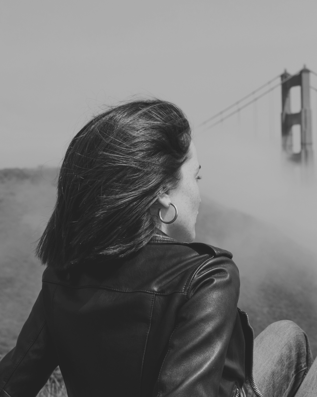 Kiki Casanova, black-and-white portrait facing the fog in San Francisco
