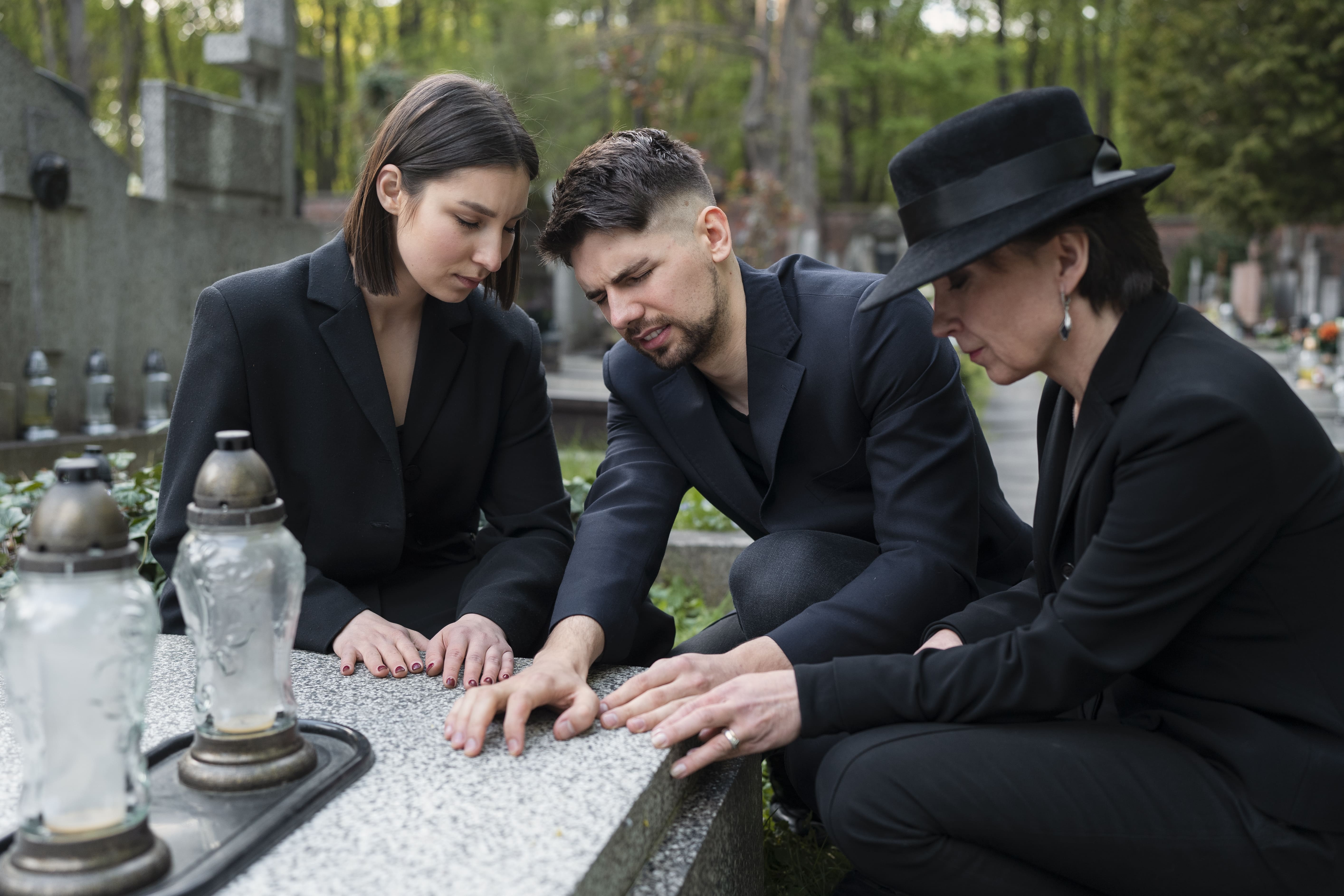 Family standing together at a cemetery