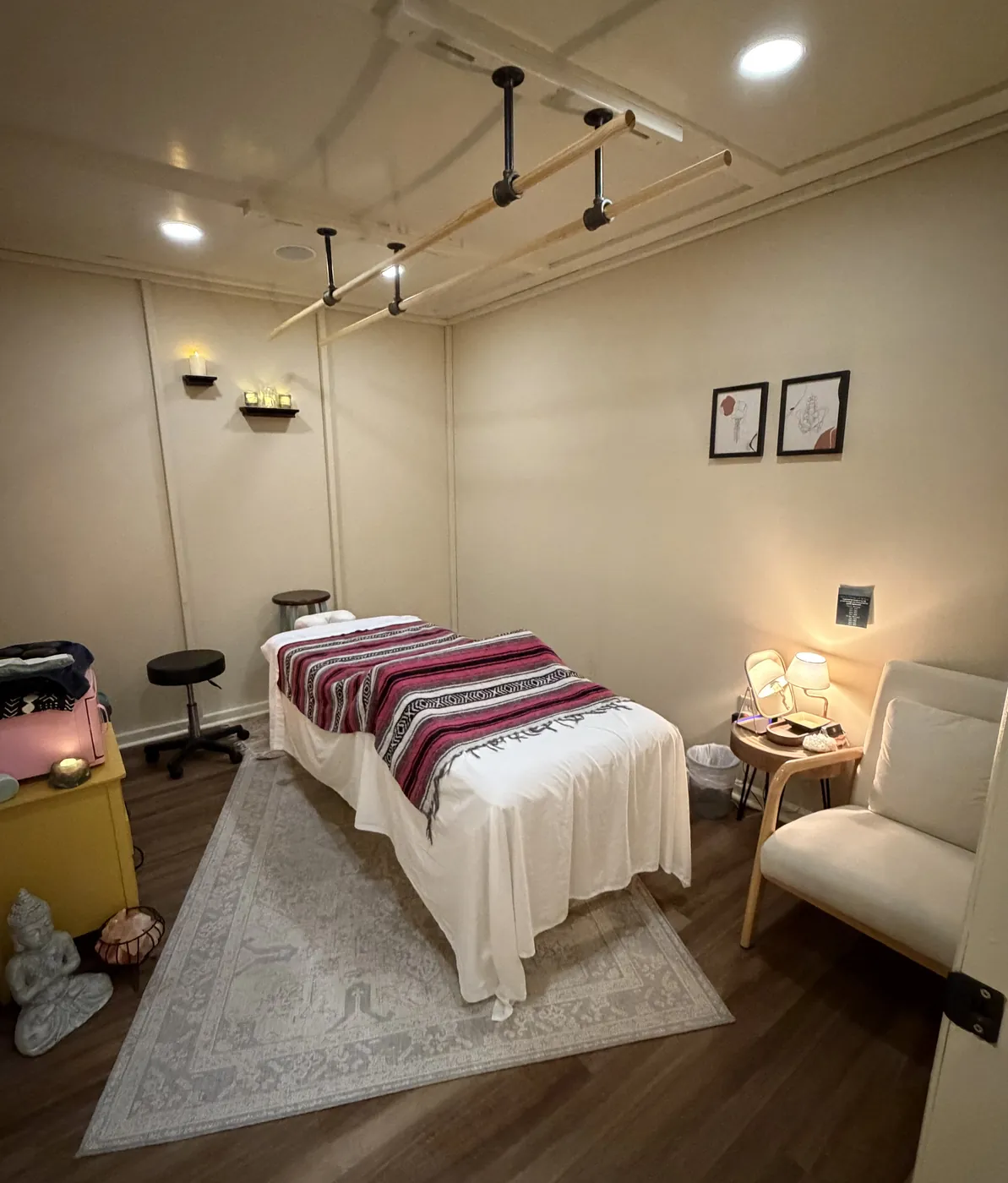 Overhead wooden bars above a massage table in the Ashiatsu room