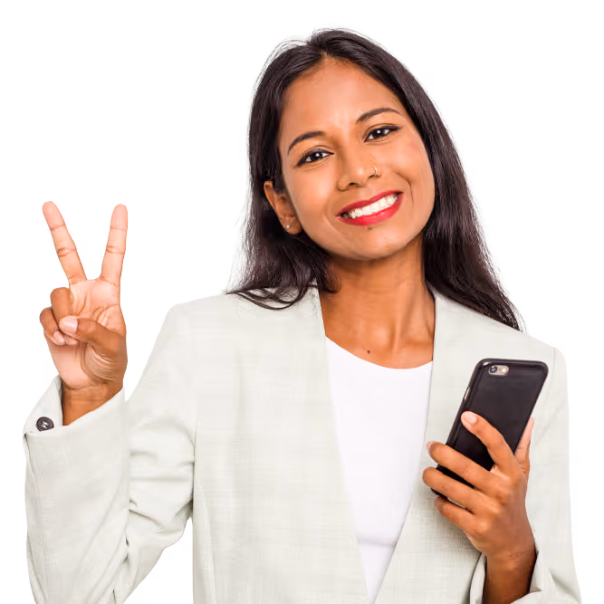 Smiling woman holding a smartphone and showing a peace sign