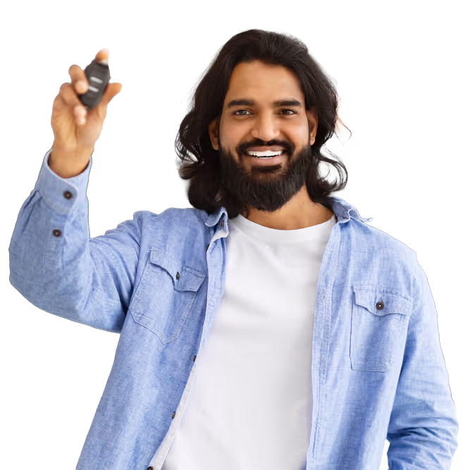 Smiling man holding up the keys to his new car