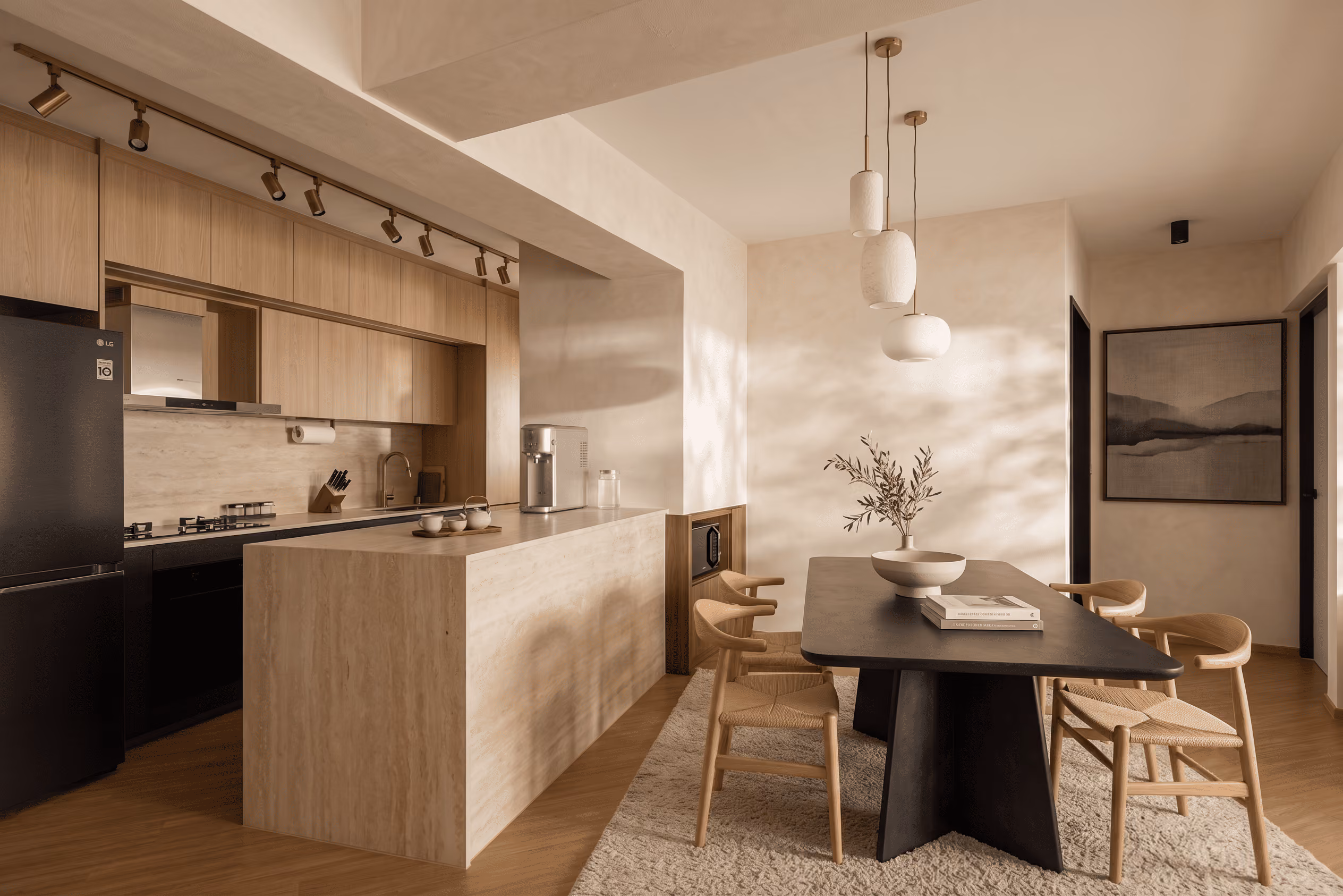 Modern kitchen and dining area with wood cabinets, black table, chairs, pendant lights, and wall art.