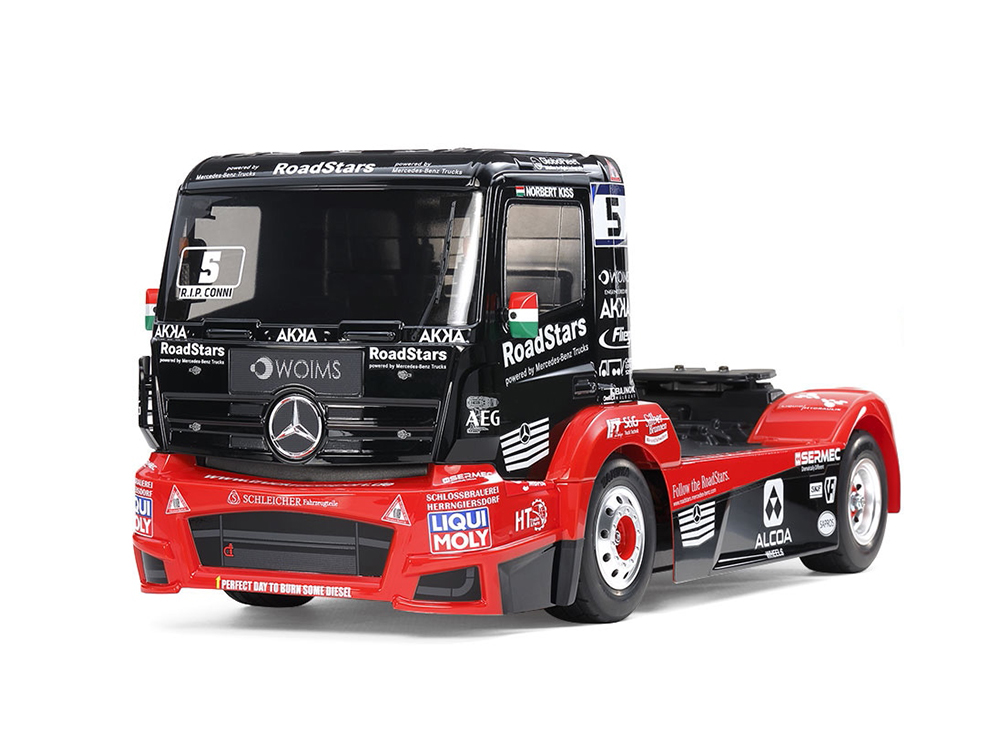 Black and red racing truck with RoadStars and Mercedes-Benz logos on a white background.