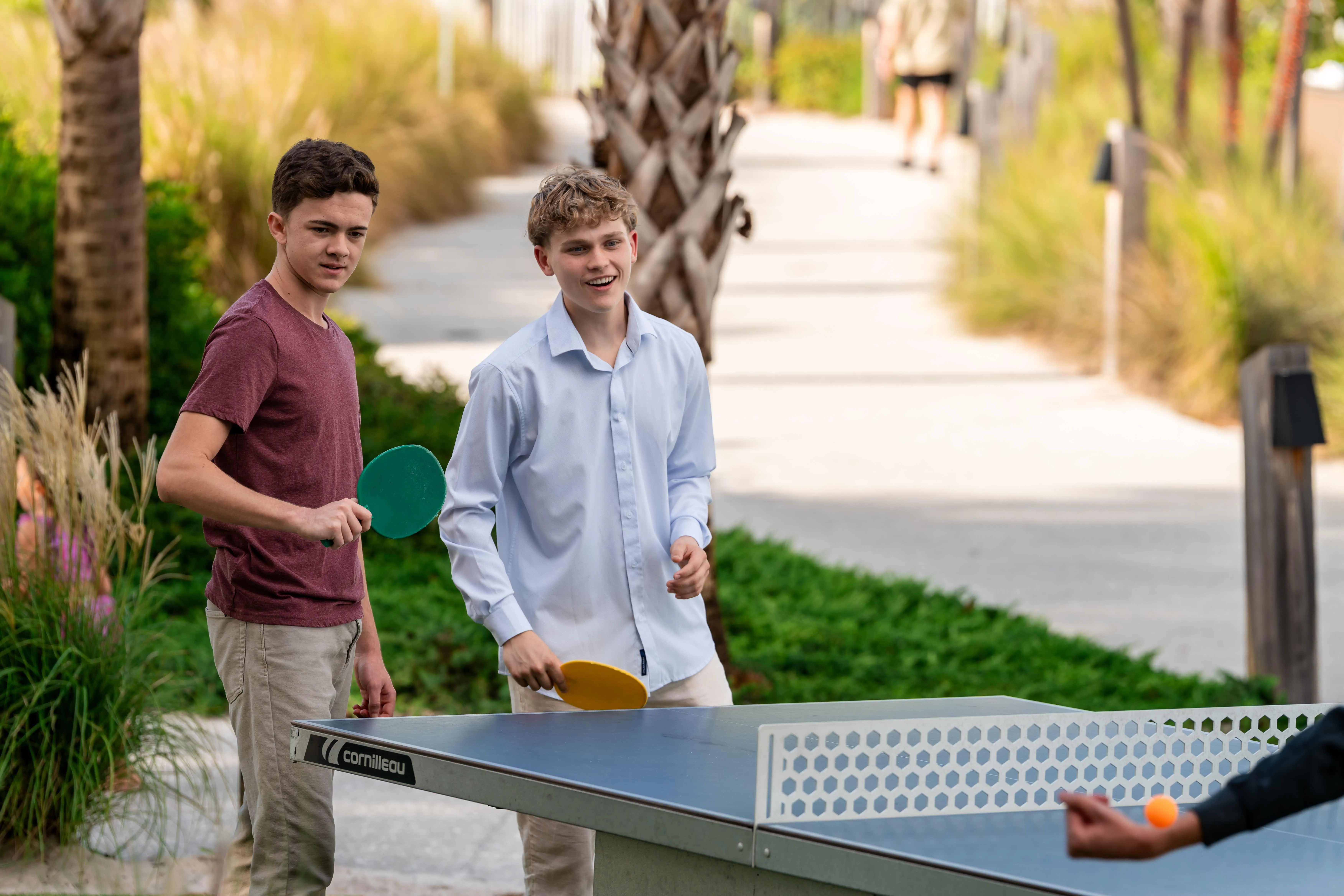 Guests playing ping pong outdoors at Evermore Resort