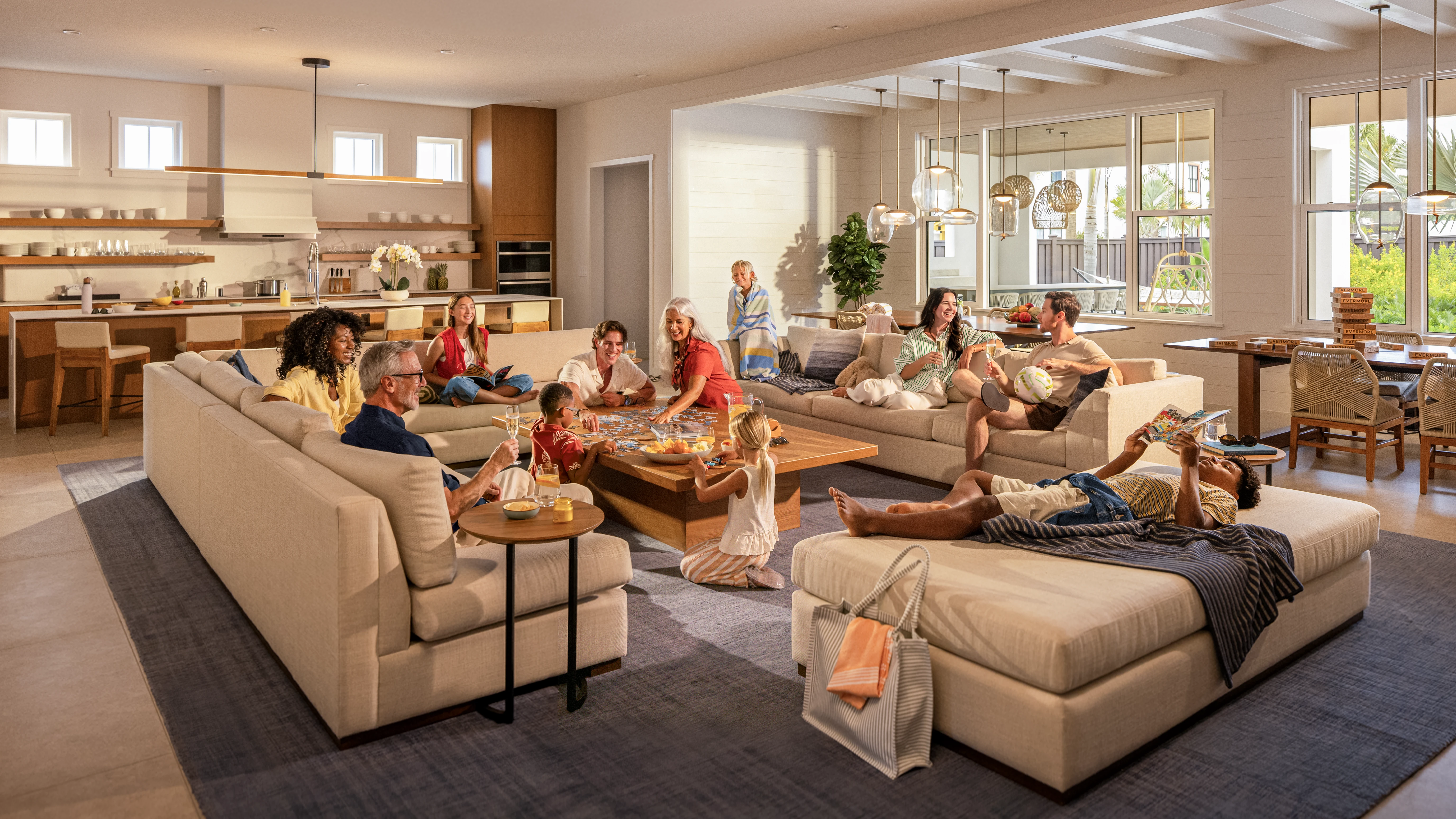 Large family gathers in a bright living room playing a board game and relaxing on beige sofas.