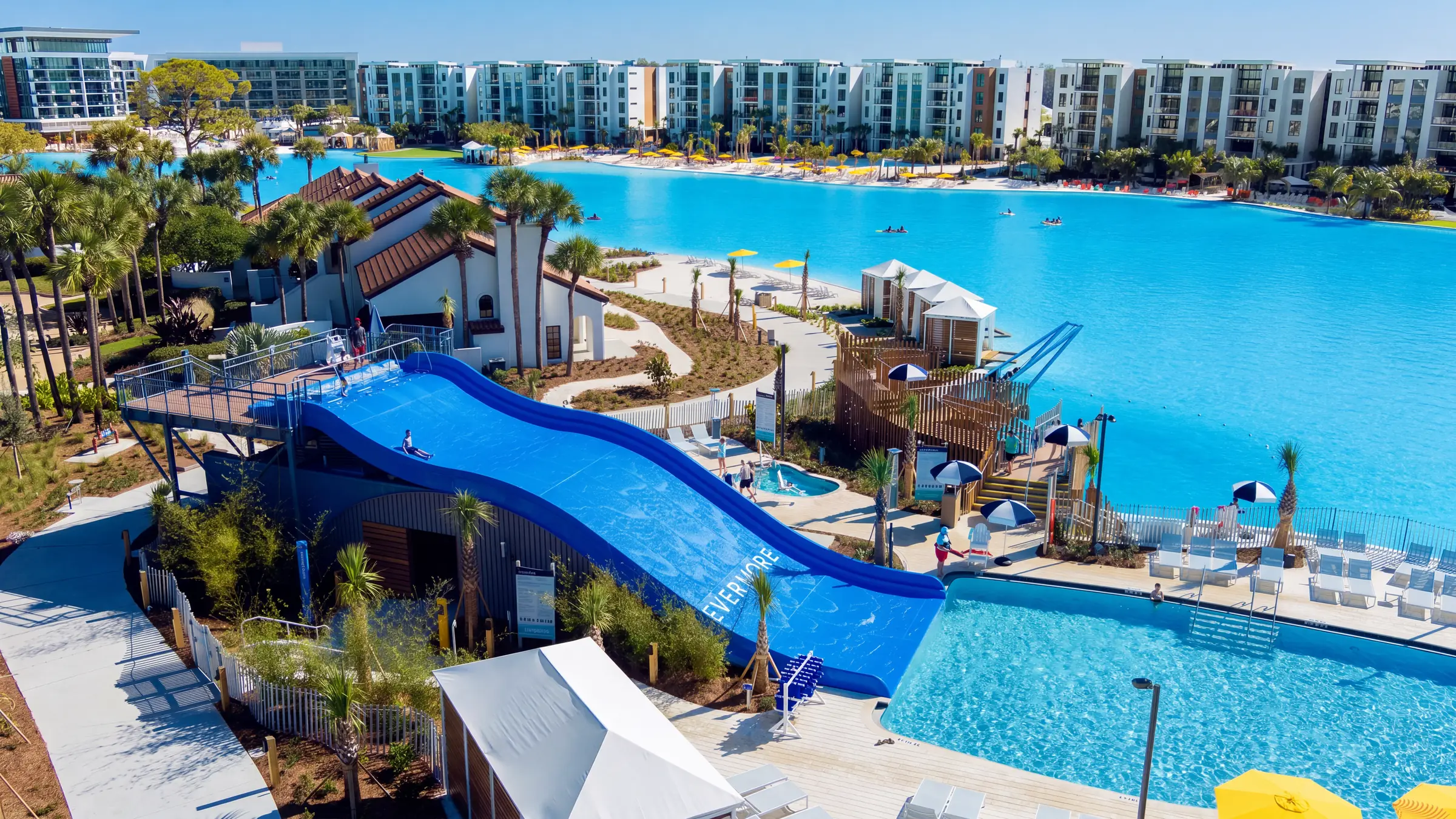 Aerial drone view of the family pool and waterslide at Evermore Bay