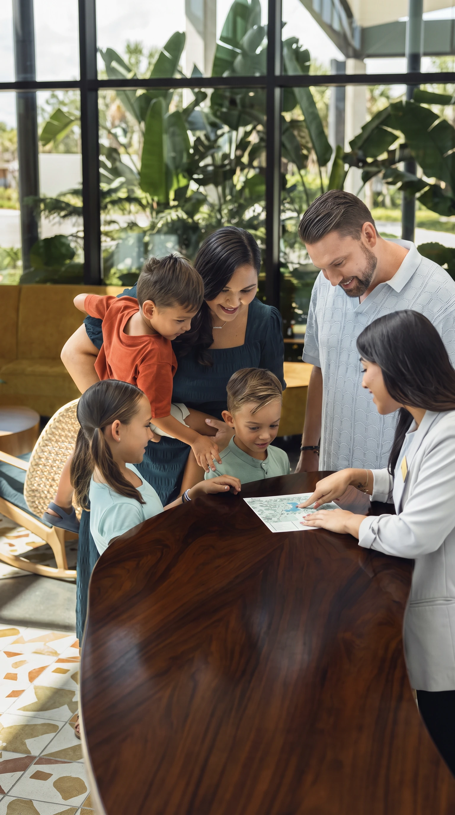 Family checking in with a Guest Services team member at Evermore