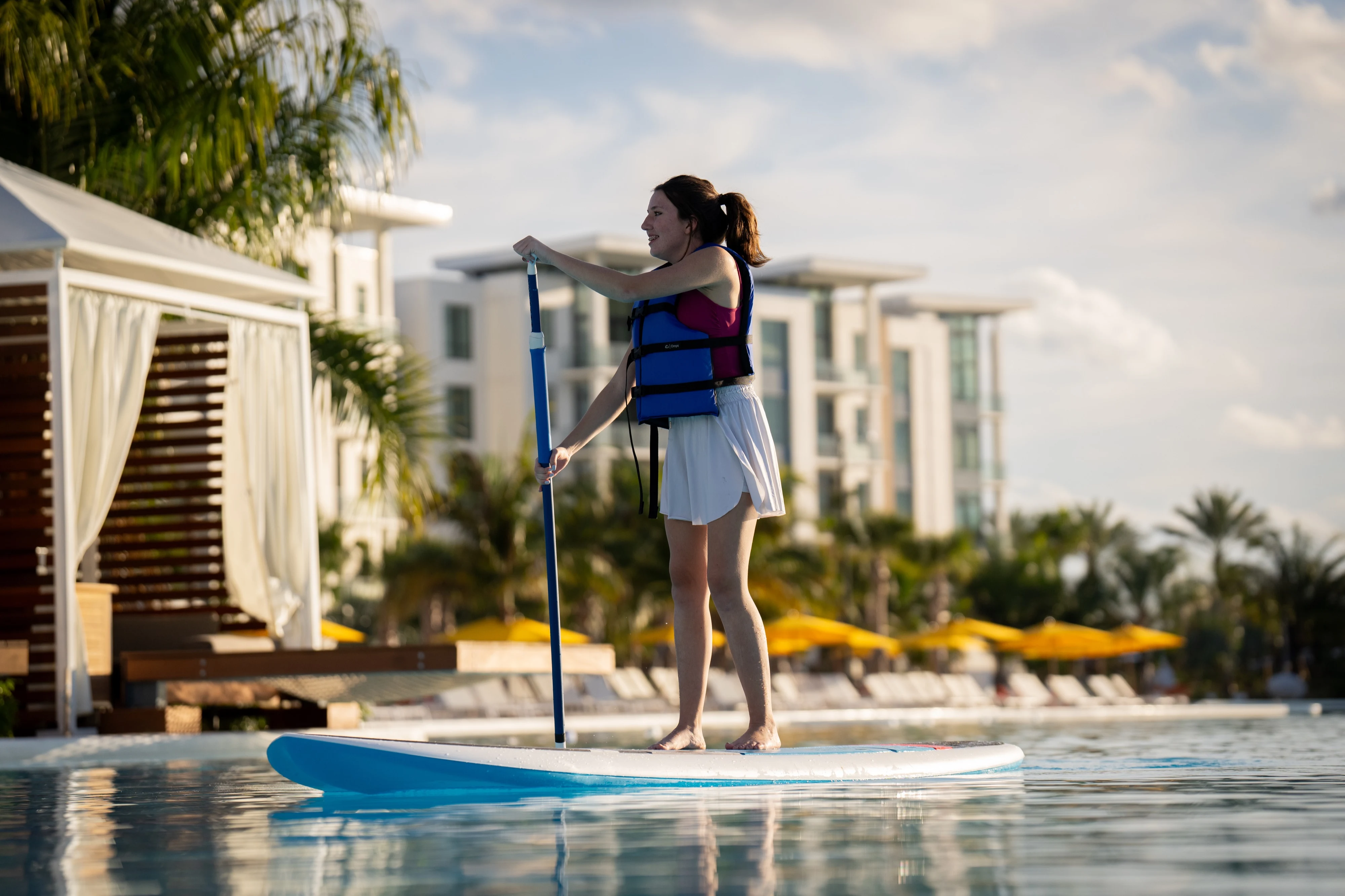 Paddleboarder on Evermore Bay near cabanas